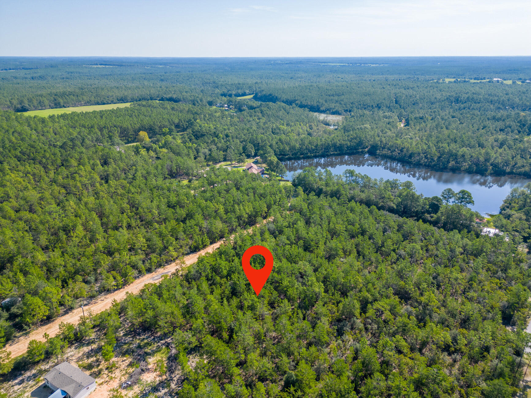 0.45 of an Acre Vacant Lot  High and Dry, Non-Flood Zone. GREAT LOCATION! Mobile homes are allowed with No HOA Fees! 

This spacious lot offers convenient access to major highways (HWY 90, I-10, 285, and 331). HWY 90 is just under 2 miles away, and the DG Market Store is less than 4 miles away. Located approximately 12 miles from essential amenities like hardware and grocery stores, schools, downtown, and the historic Lake DeFuniak, this lot offers both convenience and tranquility. Nature enthusiasts will be thrilled to discover the abundance of outdoor activities nearby, including fishing, golfing, national parks, and the stunning beaches of the Emerald Coast. (Close by popular cities: Niceville, Crestview, Fort Walton Beach, Destin Florida, 30A / Seaside, and Panama City Beach)

While no utilities are currently installed on the lot, electricity is available in the street; Water can be accessed through a private well, or a public connection with Mossy Headwater, for sewer service, a septic system would need to be installed. County-maintained gravel road.

This parcel contains 8 small lots, and according to the plat, with the plat indicating the possibility of future additional access through Lime Street if the road is opened.

Claim your piece of Florida land!

Adjacent lots Parcel A and C and lot E are also available for sale.