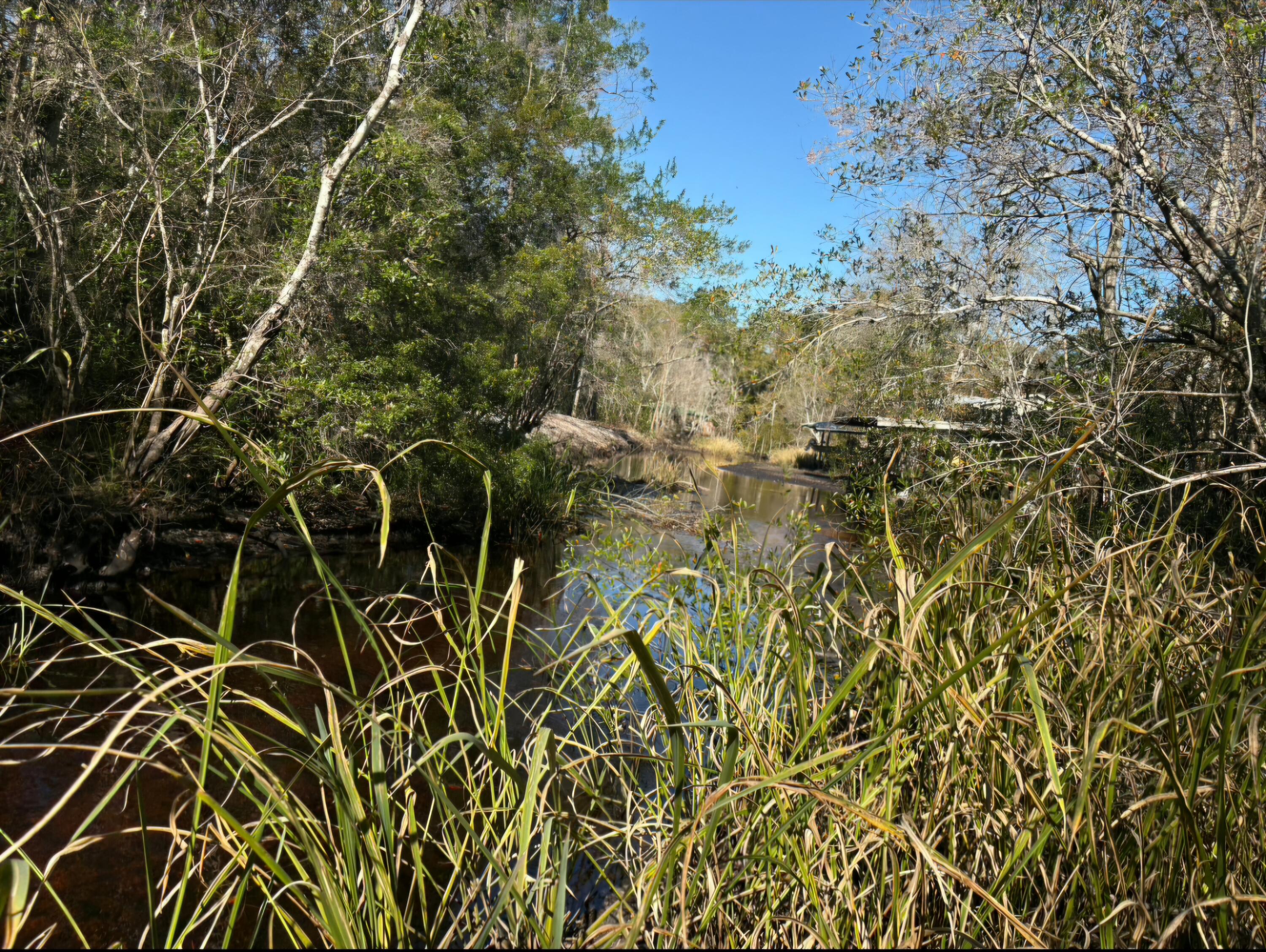 Seller has lowered the price!  A great opportunity to live or play in a rural fish camp.  This waterfront lot on a canal provides access to the infamous Choctawhatchee River providing some of the best fishing and relaxing around.  Located within 20 minutes to shopping, dining and the beaches of Panama City Beach and 30A. Build a vacation cottage or bring your RV and boat for a great time. Buy this lot and be apart of the elite Steelefield recreational group of people that enjoy their weekends away from all the traffic, noise and people!
