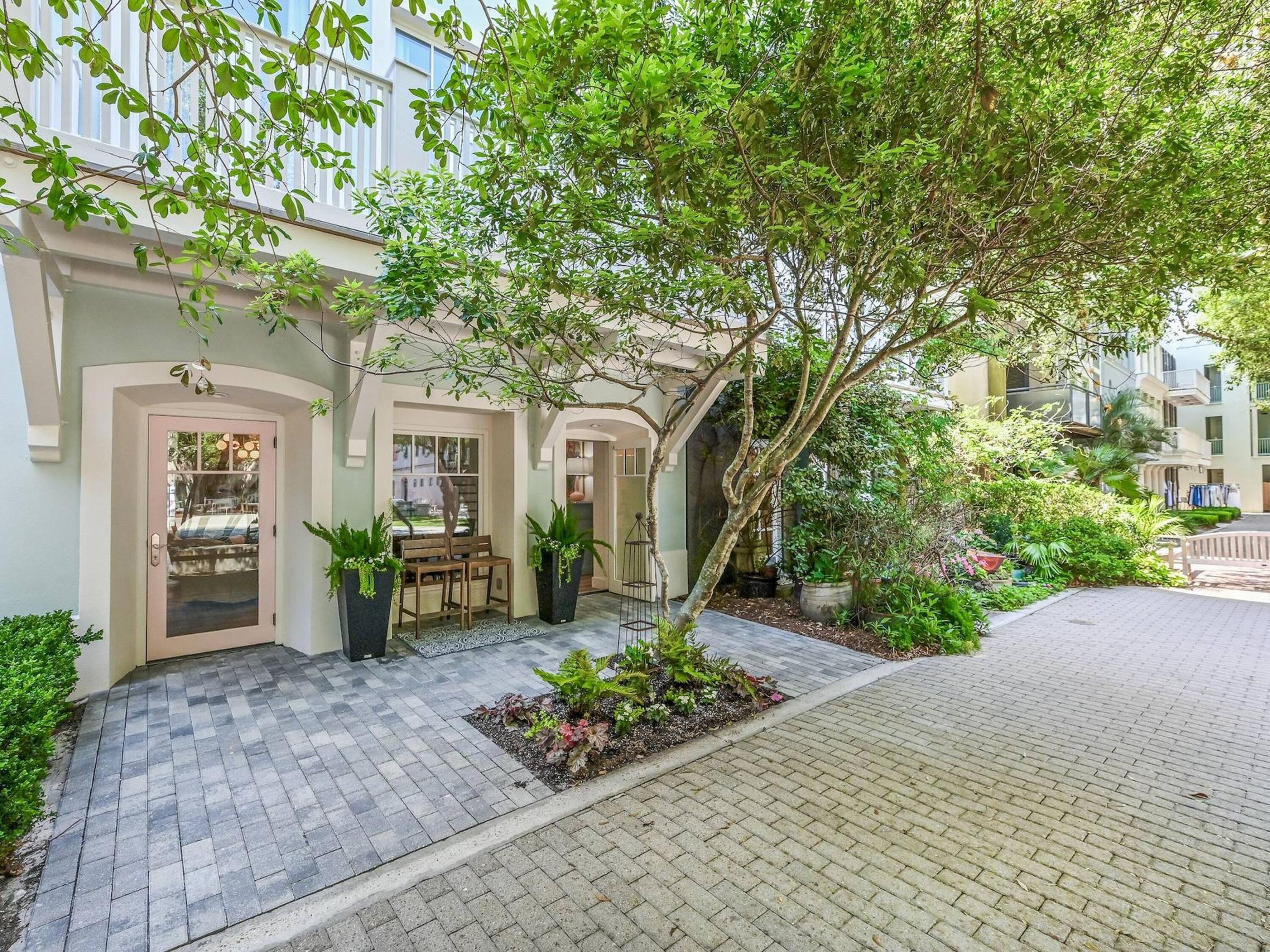Welcome to 303 Ruskin Place, an extraordinary residence nestled in the heart of the picturesque community of Seaside, Florida. This stunning four-bedroom, four and a half bathroom home has been masterfully remodeled, offering a blend of modern luxury and timeless elegance. As you step through the front door, you'll be greeted by an all new open-concept living space bathed in natural light, featuring all new exquisite finishes. The new decor seamlessly combines coastal charm with contemporary sophistication, creating an inviting atmosphere perfect for both relaxation and entertaining. A newly decorated bedroom and bath complete the first level making this home a complete residential townhome with a two car covered carport. The kitchen is a chef's dream with renewed cabinetry and new beautiful quartz surfaces, equipped with top-of-the-line stainless steel appliances.Adjacent to the kitchen, the dining area offers a perfect setting for family dinners and intimate gatherings. There are two living spaces on the kitchen level allowing families to have unique spaces for evening entertainment. The primary suite also has an en-suite bathroom with dual vanities, a soaking tub, and a walk-in shower. Each of the additional three bedrooms has been thoughtfully re-designed with comfort and style in mind, featuring ample closet space and access to beautifully updated bathrooms. Outside, the home features the charming courtyards or Ruskin Park along with the upper roof top deck with views of the town and the gulf. The meticulously landscaped grounds enhance the home's appeal and provide a tranquil oasis for outdoor activities. Located just steps away from Seaside's iconic white-sand beaches, boutique shops, and evening dining, 303 Ruskin Place offers the quintessential coastal lifestyle. This remarkable home is a rare find, combining impeccable design, prime location, unparalleled comfort and turnkey ready completely updated in the last 18 months.