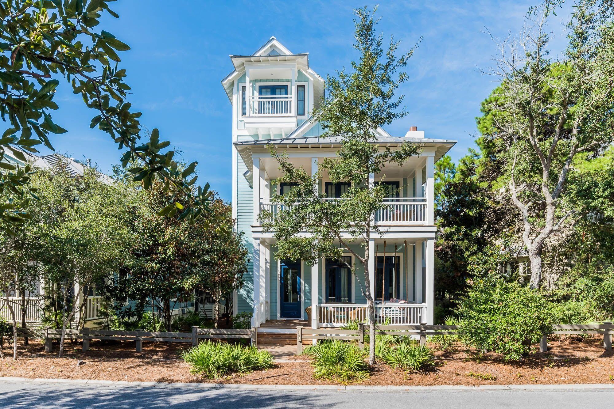 Sweeping front porches, cozy outdoor furniture and the perfect hues of blue welcome you to this spacious 4 bedroom, 4 1/2 bath beach house with a third floor tower. Conveniently located on Western Lake Drive in the Park District of WaterColor, this home's soaring ceilings and natural light greet you as you enter this home boasting coveted first and second floor master bedrooms. Vast windows and 12 foot ceilings accentuate an open, airy floor plan, made for entertaining guests. The expansive living room offers Southern charm with white wood paneled walls, transom windows and a brick fireplace that set the mood for making memories here. The kitchen offers high-end appliances with additional eat-in dining space and a conveniently located wet bar. The roomy first floor master ensuite features a private bath with dual vanities. The second level of the home offers an additional cozy living room space and bonus bunk room, perfect for the kids or kids at heart. Also on this level is a spacious master bedroom ensuite with a private covered porch, as well as, a guest bedroom ensuite featuring beautiful French doors that lead to a large covered porch that was made for relaxing. The third floor tower offers breathtaking views of WaterColor and Western Lake, featuring Gulf views and a conveniently located wet bar, perfect for entertaining. The exterior of the home offers an outdoor grilling area and outdoor shower, great after a long day at the beach. With a prime location along Western Lake Drive, this property offers a great opportunity to own and enjoy all that the coveted community of WaterColor has to offer. Both the interior and exterior of this home were recently painted giving it a fresh new look.
