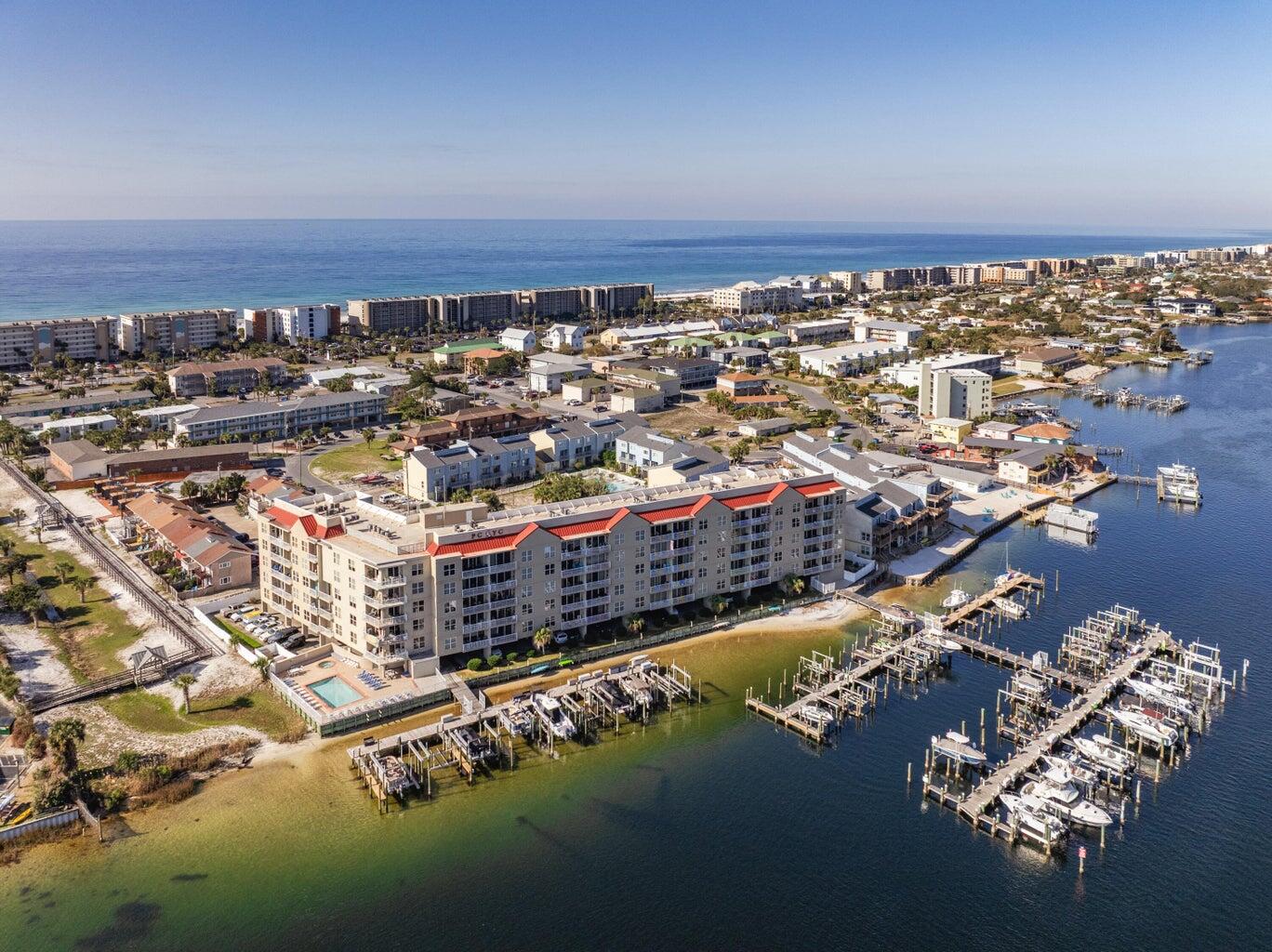 Amazing new lower price and spectacular views of the Santa Rosa Sound, Intracoastal Waterway, Brooks Bridge, and Palm Court Yacht Club.  Great opportunity to own a waterfront condo INCLUDING a boatslip and all the resort amenities. Enjoy the breezes on your private balcony, watching the boats float by and all the other sights and sounds of waterfront living. This condo unit is uniquely positioned in the development to provide upper floor views with parking right out your front door. And Palm Court Yacht Club is uniquely positioned to provide adjacent boardwalk access from the Palm Court pool directly to the Gulf by way of the Blue Dolphin Beach Access. This condo unit is ready for your updates and decorator touch so set an appointment soon to come take a look!