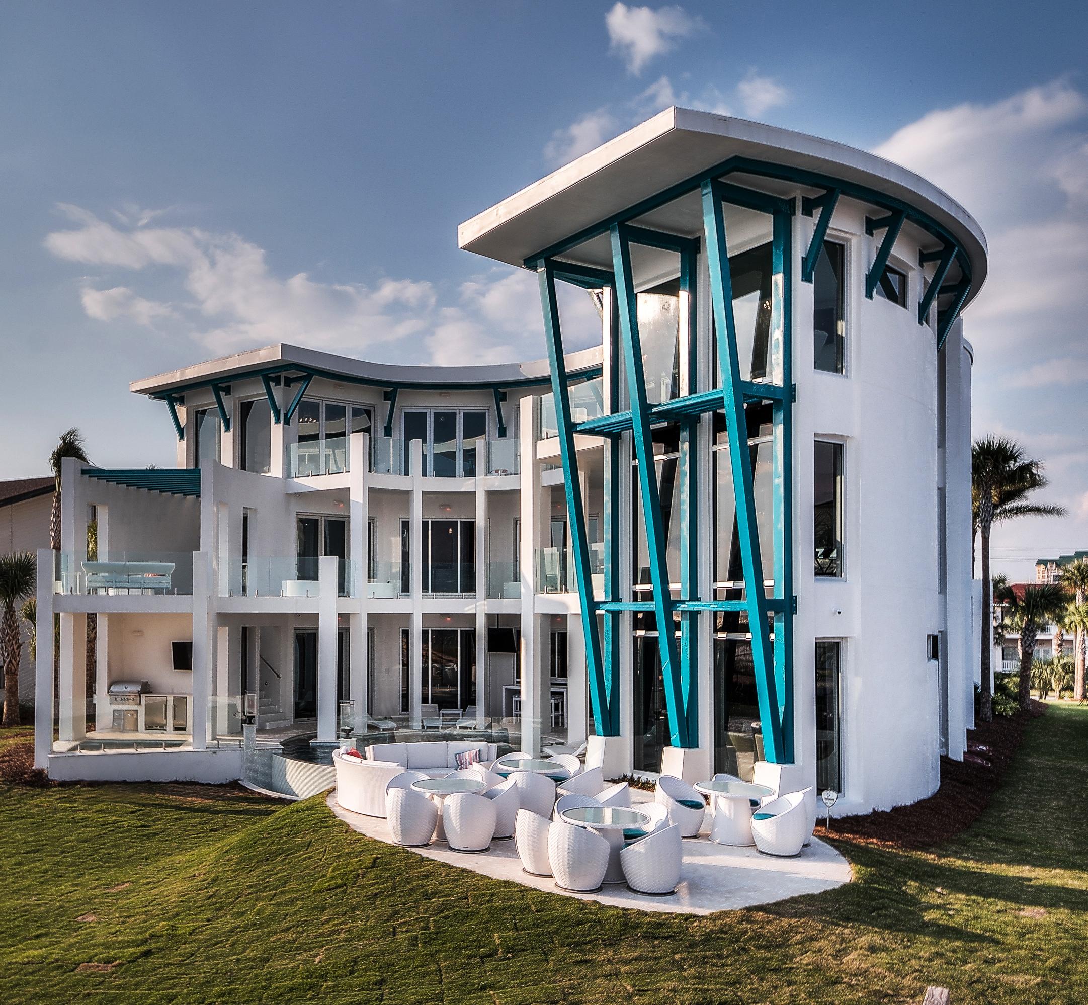 Embark on a journey to beautiful Gulf-front living, down Destin, Florida's Holiday Isle. Arrive at a bracingly original, private retreat known as Destin Jewel, a newly constructed sanctuary that perfectly blends the spirit of nature with sophisticated fabrication. Experience the harbor's distant jetties, three miles of snow-white beaches, and an occasional school of dolphins from your own secluded paradise. This stylish Gulf-front residence is designed to rival the world's finest resorts and incorporates the highest-level construction standards. Exterior walls are poured concrete over steel I-beam construction and are built to withstand wind speeds of up to 150 MPH, equal to a Category 4 hurricane. Vacation rental income will top $700K in 2018. Destin Jewel is an iconoclastic luxury landmark with a landscape reflective of simple Florida living. Privacy equals tranquility on over an acre of gulf front property with one hundred feet of gulf frontage. Views of the Gulf of Mexico's aquamarine waters and the harbor's distant jetties are unparalleled with more than three miles of shoreline visibility. Natural stone pavers lead the way to minimalist, modern design accentuated by a blue metal roof and aqua-colored decorative cladding. The owner conceptualized this home's crescent-shaped design and renowned Archiscapes Architects completed the ideation, which seamlessly blend indoors and out. Destin Jewel incorporates five-star amenities in three stories and 9,000 square feet of heated and cooled living space plus an additional 5,000 square feet of balconies and outdoor hardscapes, Your adventure to sublime continues as you enter to a 35' foyer where walls of glass draw your attention to the unforgettable sea's still waters. Before venturing outdoors, you pause for a moment to take in the chic chandeliers and the striking circular glass elevator. A stunning wood and glass free-form staircase, accented by subtle LED lighting wraps around the elevator and leads dreamily upstairs. Minimalist, neutral interiors, natural limestone floors and clean-lined European cabinetry sit quietly and seductively, encouraging all eyes to remain on the dazzling outdoors. From every vantage point, multi-hinged walls of windows fold into obscurity allowing all eyes to marvel at miles of unspoiled beaches. Glass wind reduction railings adorn deep outdoor balconies allowing the admirer to float above emerald green waters. A decadent, free form, custom, infinity pool is located just outside the first-floor living spaces and is visible from all floors. This luxurious pool delights all the senses and calls for dramatic appreciation of the pool's central fire feature with glass enclosure and accent fire torches, theatrical LED accent lighting, two swim-up bars, and an in-pool sundeck. This entertainment oasis is remarkable and is certain to be central to all activity in the home including meals, compliments of the connoisseur's outdoor kitchen. Gulf-side outdoor seating accommodates large parties in stylish furnishings. Located separate from the pool, the heated spa with seating for 12 features an independent HD TV and audio system and two separate massage jet motors for each person. Anti-glare TV screens line the outdoor oasis for a total of 19 total Smart TVs through the home. A surprise, regulation sized, sand volley board court sits just beyond the manicured grass lawn and just below the natural dunes. The home's main floor kitchen is any chef's indulgence. Precise design conceals the complexity of futuristic appliances and perfection in maneuverability. Light reflecting marble countertops, a striking yet simple glass tile backsplash, copper sinks and fixtures, and sleek striated-white oak cabinetry echo the home's timeless detail. The central kitchen includes two full size 30-inch Subzero refrigerators, two full 30-inch size Subzero freezers, three sinks, two dishwashers, a three-burner gas range, and a four-burner magnetic cook top. The elegant living room encourages guests to gather and is serviced by a fully equipped bar with a commercial wine refrigeration. First floor, banquet-style dining seats twenty-five, and bar seating accommodates an additional ten. If indoor entertainment is on the agenda, move to the spirited state-of-the-art theater with a 119" projection screen and Dolby Surround Sound. Cosmopolitan appeal meets southern comfort in seven gulf front bedroom suites and a playful two-bedroom children's wing. Each of the seven private suites is the pinnacle of style and relaxation. In each en suite, an unexpected jewel tone is added to hand-painted, poured concrete flooring and custom lighting for a striking contrast to otherwise neutral tones. Luxurious private baths incorporate ultimate creature comforts and the whimsy of unique glass tile that continues the jewel theme from the bedroom. The second floor gathering space, reminiscent of a luxury cruise liner's bar, blends football colored leather and striated-oak cabinetry for a masculine feel. Three 55" TVs line the bar's backdrop for endless viewing pleasure. An expansive harbor party deck and an additional private balcony cigar lounge compliment the bar area.
The kid's suite will enchant the younger set. Concrete floors are hand-painted with the wonders of the ocean. Two custom-crafted birch bunk beds imitate the lore of pirate sailings. Custom painted mermaids peak over the ship's bow, luring the slumbering child out to sailing. Additional sleeping quarters adjoin the ship's bedroom. Both bedrooms can easily accommodate twelve children. The children's bath combines bright colors and hard surfaces for ultimate durability. The double shower and triple sink ensure that there is no need to fight for bathroom time. The home's third floor includes a lounging area, and each floor incorporates laundry facilities. This smart-home design is controlled via in-home touchscreens. The security system, wireless system, and thermostatic controls are all enterprise grade. The cost to own this impressive home is low.  Qualified purchasers are invited to tour this luxurious beach home. Call for your opportunity to experience this remarkable testament to exceptional living.