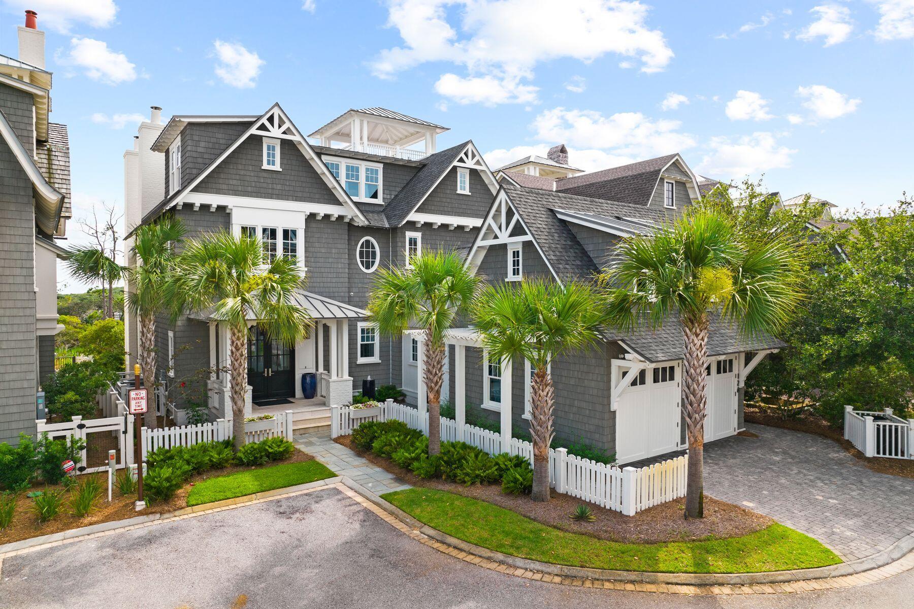 Every so often, a truly remarkable ownership experience presents itself along the Emerald Coast and this 3,900-sq.-ft.-plus retreat presiding over gulf views and protected sand dunes is befitting of the title. It has been exquisitely maintained as a second home, offering a turnkey escape for those looking for solace at the beach. Epitomizing both Nantucket-inspired design as well as a southern Craftsman-style build, this WaterSound Beach gem is replete with multiple outdoor living spaces that combine to exceed 1,600 square feet of porches, a watch tower with gulf views and a private saltwater pool with nearby summer kitchen. Inside is a mix of warm wood flooring, cool granite and limestone countertops for an elevated living experience. The kitchen is finished with Thermador appliances and a butler's pantry, flowing into a living room with beamed ceilings and a fireplace. The four bedrooms are spacious including a lush owner's suite that features a sitting area with gulf views and a spa-like en suite bath. A bunk room that sleeps four and a two-car garage add additional sleeping accommodations and conveniences. WaterSound Beach is a captivating coastal community connected by winding wooden boardwalks and trails in an idyllic setting that includes access to the sandy white beaches, a neighborhood swimming pool, green spaces, golf courses and all of the shopping, dining, entertainment and attractions available in South Walton.