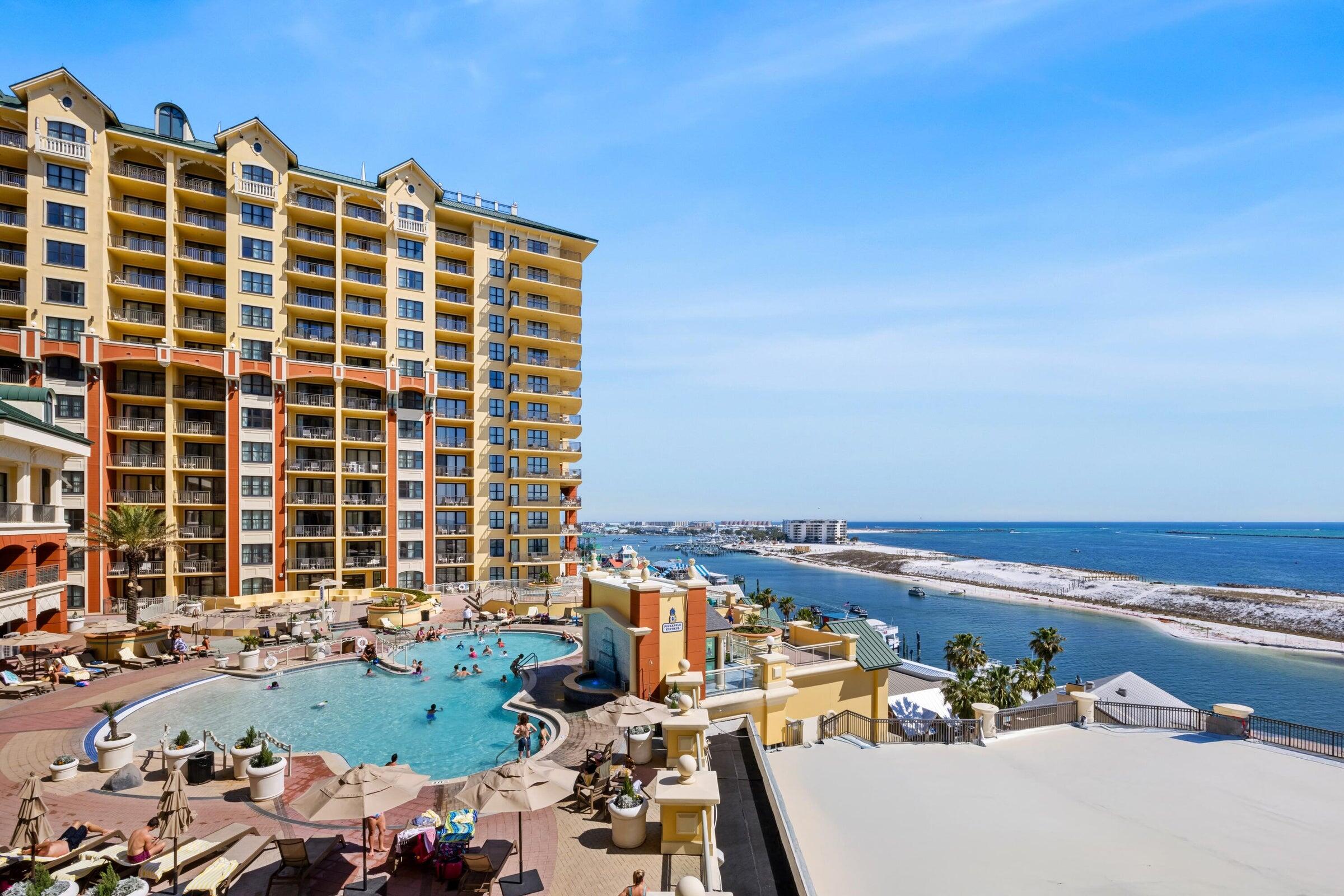 Perched along the shimmering edge of Destin Harbor, Emerald Grande W828 emerges as a rare coastal jewel--an investment opportunity wrapped in spectacle, serenity, and substantial return. This waterfront sanctuary not only commands spellbinding sunset panoramas but also boasts the uncommon luxury of its own stretch of sand, where the horizon melts into hues of amber and rose each evening.

With an impressive $87,000 in established rental revenue, this residence is far more than a picturesque retreat--it is a proven income-generating asset. Within the building, only a select few units offer the coveted configuration of three full bedrooms paired with three well-appointed baths, making this particular condominium an exceptional find. Step inside and you are greeted by interiors that feel both curated and inviting. The décor has been thoughtfully refreshed, blending coastal elegance with modern sensibility. Underfoot, sleek wood-look flooring flows seamlessly throughout--no trace of carpet, only clean lines and effortless upkeep.

Beyond the residence itself lies a collection of amenities that rival those of elite resorts. A gently sloping, zero-entry outdoor pool invites leisurely dips beneath the sun, while two bubbling hot tubs promise relaxation after a day on the water. An indoor pool offers year-round enjoyment, complemented by a lively poolside bar. Fitness enthusiasts will appreciate the expansive gym, while those seeking indulgence can retreat to the onsite spa or savor cuisine at the in-house restaurant. Even practicalities are elevated here, with EV charging stations and an array of additional conveniences woven into the experience.

Emerald Grande's placement on Destin Harbor is nothing short of strategic brilliance. Just steps away, Harborwalk Village unfolds with its vibrant tapestry of dining, boutique shopping, live entertainment, and aquatic adventures. Whether you crave a sunset cruise, fresh Gulf seafood, or an afternoon of watersports, everything lies within effortless reach.

In essence, Emerald Grande W828 is not merely a property--it is a lifestyle investment, where revenue potential and coastal enchantment coexist in perfect harmony.