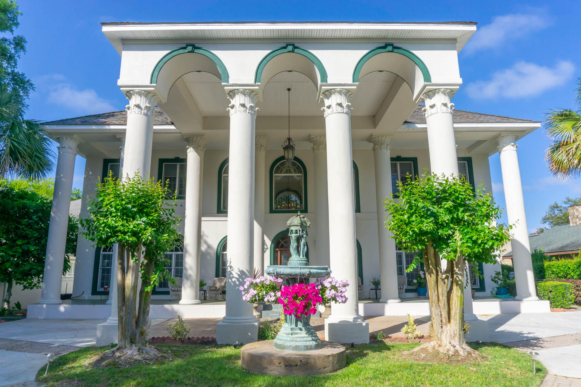 Nearly 100 feet of bay waterfront with a private sandy beach and over an acre of land, this lavish 10,000+ square foot home in the charming fishing village of Destin offers genteel living.  A 20 foot wall of imported teak bookcases with a Vermont casting gas stove to read by in the library,  2 gas fireplaces, 4 built in niches for artwork, a glassed atrium in the great room with 3 large skylights for natural sunlight, a custom teak bar with built in 90 gallon fish tank, a maid's bedroom with separate entrance and a free floating double staircase entrance with gorgeous crystal chandelier in the center more grand than Scarlett O'Hara's provide the setting for friends and family to gather in the most luxurious splendor. The oversized gourmet kitchen with built in breakfast nook for 8 with hidden bench storage encourages quality meals together.  With 22 foot ceilings in the great room and 12 foot ceilings throughout the rest of the 1st floor along with 10 foot ceilings on the 2nd floor, this gorgeous home creates open-ness and space.  Thassos white marble floors throughout the 1st floor and in the master bathroom, Cortec Acacia planking on the 2nd floor, and custom 6 inch crown molding and floor molding throughout, demonstrate the highest building quality.  Guests find relaxation and living in the 2 bedroom, 1 bath carriage house above the 4 car garage.  The 3rd floor bonus room includes a pool table, full bathroom and whimsical handpainted walls.  Extensive landscaping with mature orange, tangerine, lemon and grapefruit trees that surrounds the natural, self-propagating pond, gazebo, large free form swimming pool, jacuzzi, pool bath and natural gas grill.  The outdoor beauty of the backyard oasis and waters of the bay are best enjoyed from the expansive porches on all 3 levels of this incredible home.  Located in the neighborhood of Cobbs Point adorned with mature southern oak trees, there is no through traffic, making this gated estate enclosed with a wall incredibly private.  5 minute car ride to the Destin Harbor that hosts the finest seafood restaurants, live music, and year round festivals. 5 minute boat ride to crab island and the Gulf of Mexico for the best deep sea fishing in the world. 
 Further details of this home include:  chandelier over stairs and porte cochere each have electric lifts for ease of cleaning, Hunter Douglas window treatments throughout, full security system with cameras, surround sound system, Guardian air purification system, transferable Sentricon termite protection, and Navien tankless circulating water heater.  Hurricane Protection includes:  Anderson Storm Watch impact casement windows on the 2nd floor bayside, custom Kevlar Armor screening curtains on the bayside 1st floor windows and automatic Generac stand by natural gas generator.  Please see attached documents for a complete list of updates.