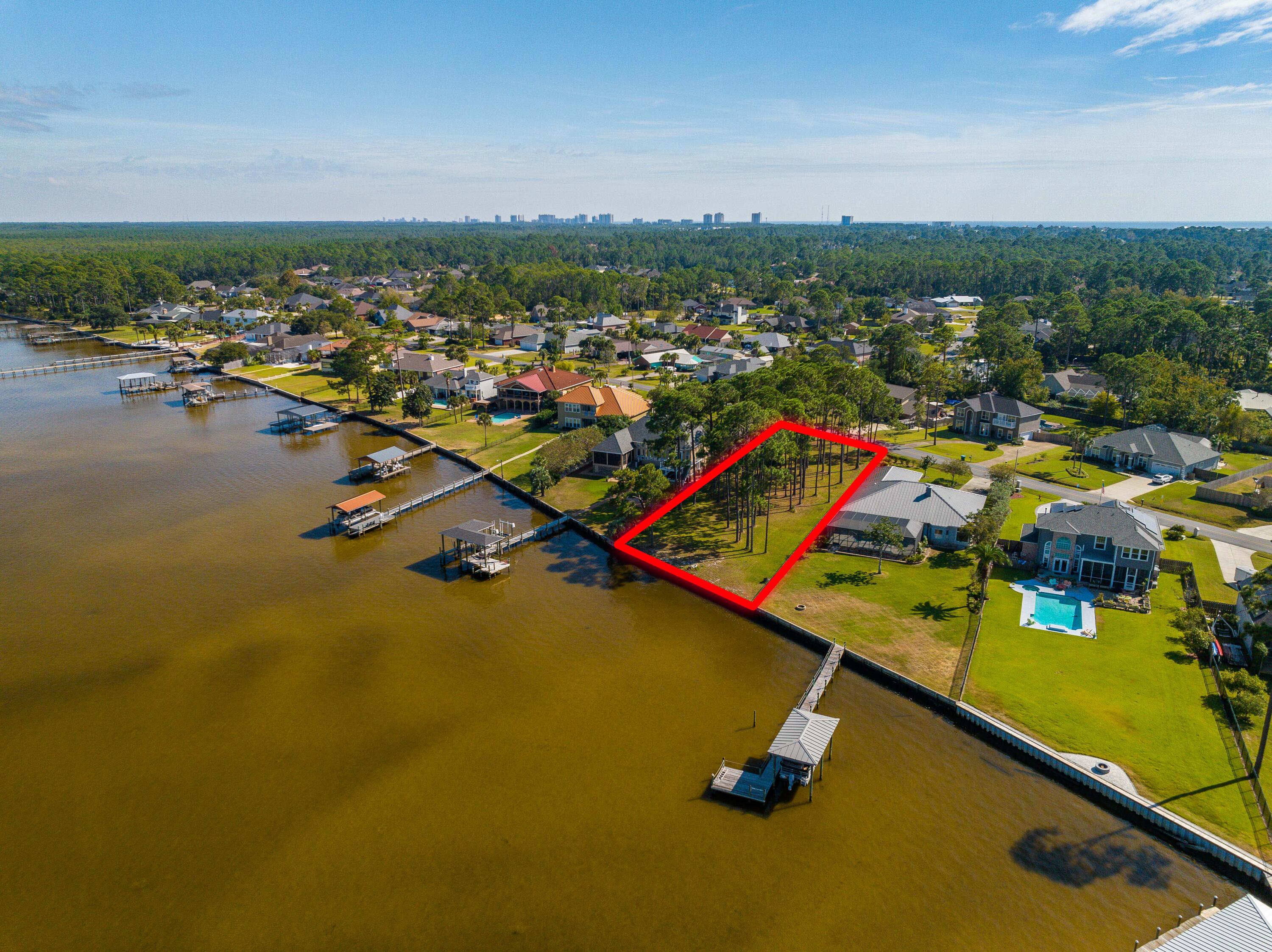 TRANQUIL BAYFRONT OPPORTUNITY | 101.1' OF WEST BAY FRONTAGE WITH GULF ACCESS

Create your legacy home at 306 Moonlight Bay Drive, a rare bayfront homesite on the peaceful shores of West Bay in Panama City Beach. This buildable parcel offers 101.1 feet of bay frontage and features a fortified seawall already in place, providing shoreline protection and long-term value. Surrounded by a slow-moving saltwater marsh, the setting is serene and naturally beautiful. Located within a designated West Bay sector plan, the area's resources are preserved for the future. Enjoy a 25-minute boat ride to the turquoise waters of the Gulf of Mexico, while remaining close to shopping, dining, golf, and the white-sand beaches of Panama City Beach. Surrounded by a slow-moving saltwater marsh, the setting is serene and naturally beautiful. Located within a designated West Bay sector plan, the area's resources are preserved for the future. Enjoy a 25-minute boat ride to the turquoise waters of the Gulf of Mexico, while remaining close to shopping, dining, golf, and the white-sand beaches of Panama City Beach.