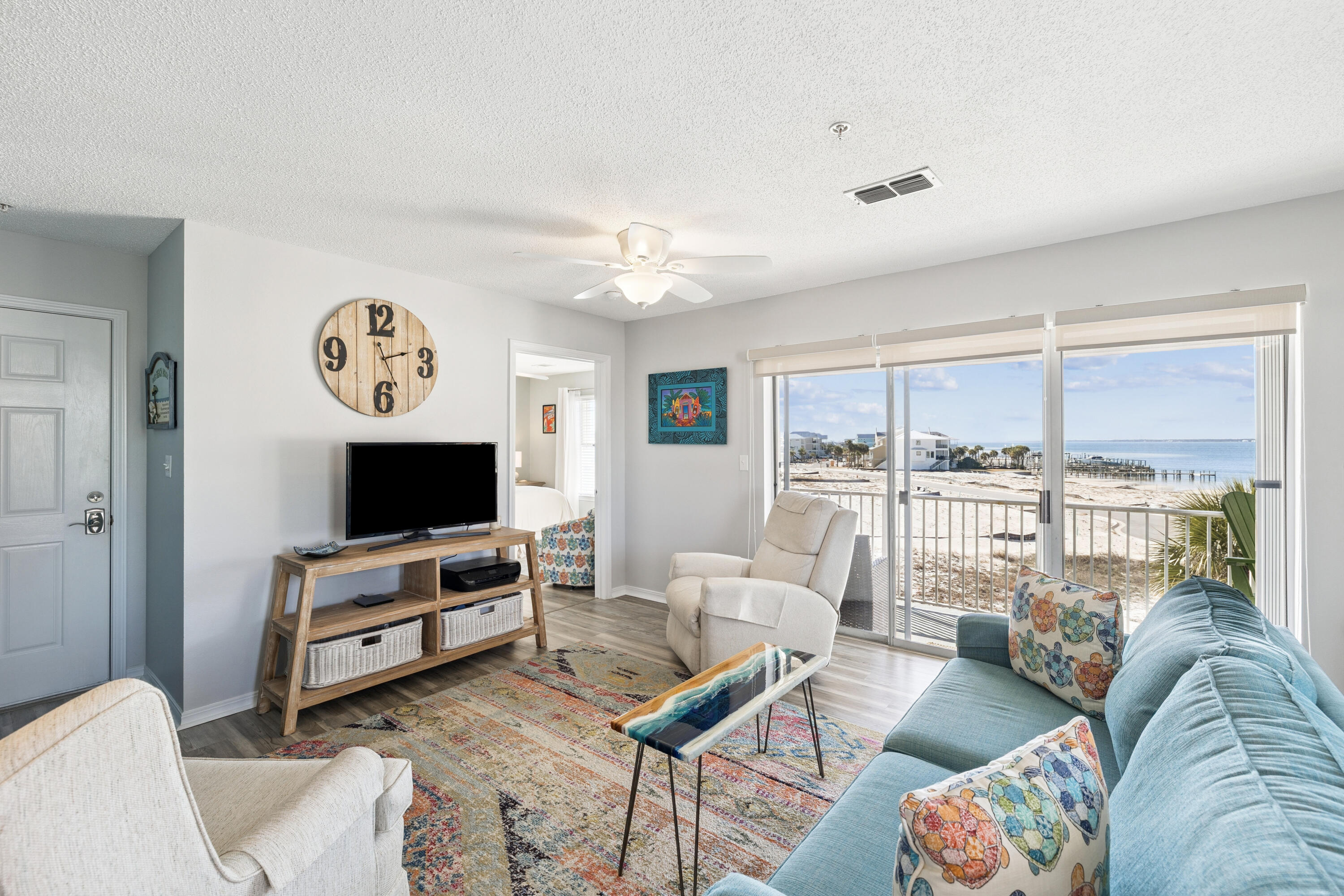 Welcome to 7464 Sunset Harbor Drive, Unit 133, a rare top-floor opportunity in Navarre where the views and serene living the area is known for meet Gulf coast lifestyle flexibility.

This 3-bedroom, 2-bath, 1,028-square-foot condo offers unobstructed views of the Santa Rosa Sound from the living room, kitchen, dining area, and primary bedroom—an exceptional feature that sets this unit apart. Step onto the private balcony to enjoy western sunset views over the water, along with peek-a-boo views of the Gulf, adding a coastal dimension few units here can claim.

The open-concept layout maximizes natural light and water views, creating a comfortable and inviting space for both daily living and entertaining. The kitchen opens seamlessly to the living and dining areas, and the unit is sold furnished, making it truly turnkey. An in-unit washer and dryer adds everyday convenience.

Located in one of Navarre's most sought-after areas, this property benefits from no through traffic, contributing to the peace and quiet Navarre is known for -- yet it remains just moments from the beach, public beach access, restaurants, conveniences, and the Navarre Beach bridge. Community amenities include a pool and grill area, perfect for relaxed coastal living.

Short-term rentals are allowed, with rental income projections as high as $60,000-$75,000 annually, making this an attractive option for investors or second-home buyers seeking rental flexibility.

Whether you're looking for a strong income-producing property, a low-stress vacation home, or both, this is a rare opportunity to own the only available unit in the building with sound views and Gulf glimpses -- in a location prized for its tranquility, accessibility, and coastal charm.

Measurements are approximate. All information is believed to be accurate but should be verified by the buyer if important. Reach out to schedule your private showing today.