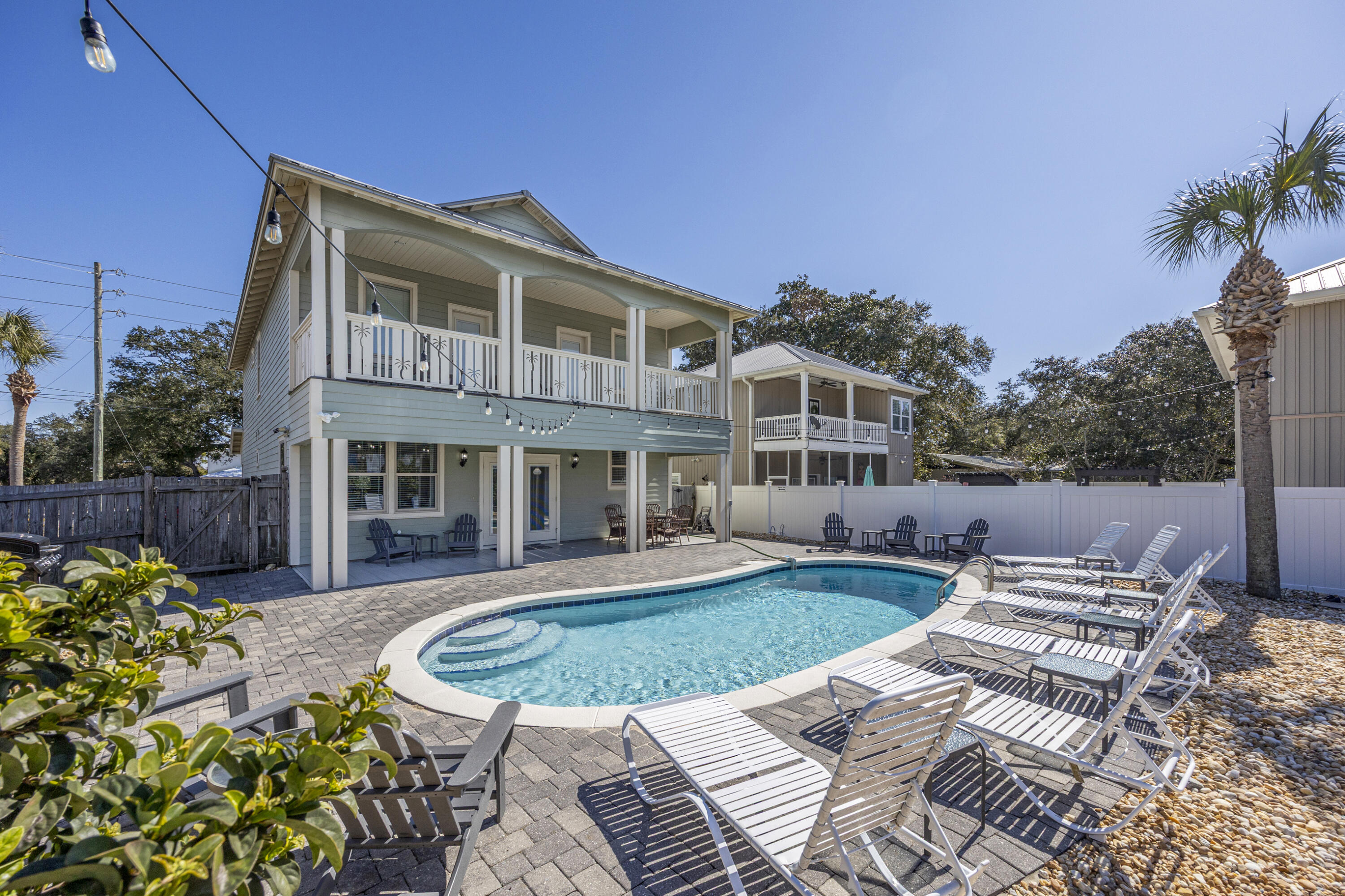 YEAR TO DATE BOOKINGS AS OF JULY 21, 2026 $153,374.64 Priced below appraisal!
Located in the highly sought-after northeast corner of Crystal Beach, this beautifully appointed coastal retreat offers the perfect combination of luxury, lifestyle, and exceptional investment potential. Designed for unforgettable beach vacations and effortless everyday living, this spacious residence features 7 bedrooms, including 4 private en-suite retreats, 5.5 bathrooms, and approximately 2,800 square feet of thoughtfully designed living space.

An open, light-filled floor plan creates the ideal gathering space, where the gourmet kitchen flows seamlessly into the dining and living areas, making entertaining family and friends effortless. Step outside to your own private backyard oasis featuring a heated pool, expansive outdoor living space, and a fully fenced yard designed for year-round enjoyment after a day at the beach.

Positioned on an oversized homesite, the property also offers the rare opportunity to add a carriage house or guest cottage, creating additional guest accommodations, increased rental income potential, or private owner quarters. Whether you're searching for a luxury primary residence, a second home, or a high-performing vacation rental investment, this Crystal Beach gem delivers the location, space, flexibility, and future upside that discerning buyers are looking for--all just moments from the sugar-white sands and emerald waters of the Gulf of Mexico. The oversized gourmet kitchen features stainless steel appliances, beautiful cabinetry, a generous breakfast bar seating 8, and opens seamlessly to the large living area. The dining table comfortably seats 12, making it ideal for gatherings.

The primary suite is located on the first floor and features a private ensuite bathroom with a separate stand-up shower and large soaking tub. The first floor also offers another bedroom with ensuite bath, laundry, and a half bath convenient for guests. Upstairs encompasses 5 more bedrooms including a king bedroom with a Jack-and-Jill bathroom connecting to a bunk room with two full-over-full bunks, another king bedroom with a private ensuite bathroom and direct access to an expansive balcony that is shared with a bunk room featuring two twin bunk beds.

Enjoy the luxurious backyard retreat, complete with a heated pool and ample space for outdoor games and relaxation. The oversized lot also provides the opportunity to add a carriage house, enhancing future value and rental potential.

Conveniently located in the northeast corner of Crystal Beach, close to dining, shopping, the Gulf, this home checks every box for location, income, and lifestyle.  Also comes with a golf cart.
***Seller offering $10K flooring allowance***