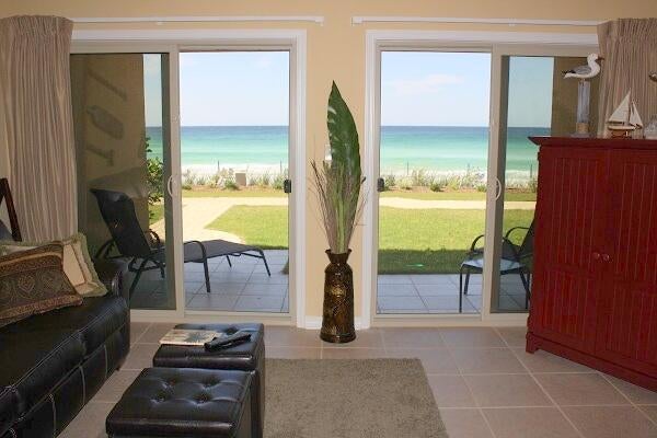 A quaint 3-story building, unit is located directly on the beach in the heart of Destin. A one bedroom fully equipped unit. With a king-size bed in the master bedroom, two bunk beds built into an alcove in the hallway, full-size kitchen, bath and a half. This unit is located on the ground floor with a breathtaking view of the beach and emerald green water. The on-site rental management company has over 30 years experience in the property management business.