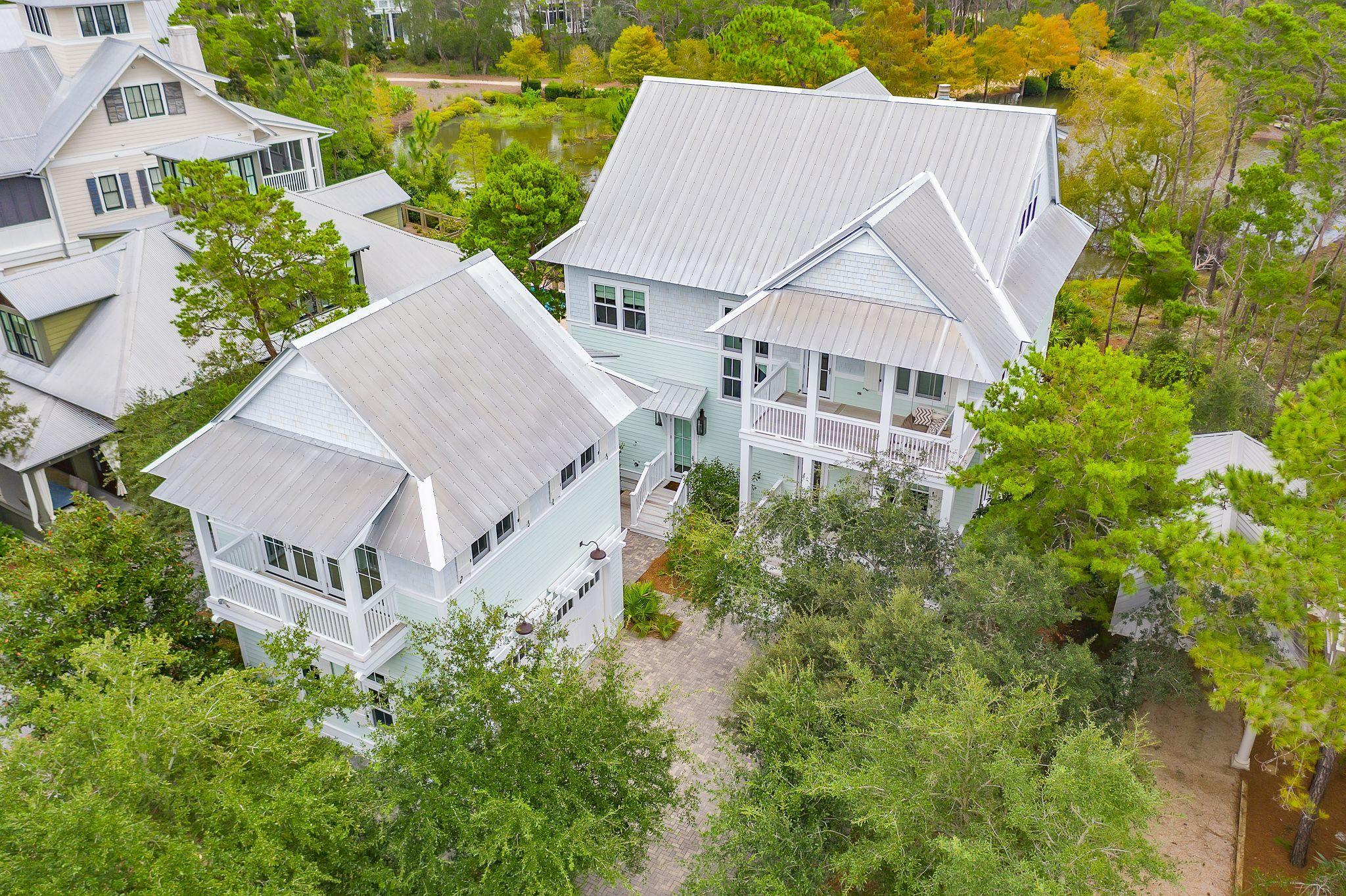 A charming light filled coastal retreat! Situated on a large lot in Phase III of WaterColor this 3 level home boasts 4,907 square feet, 6 bedrooms, and 6 1/2  bathrooms backing to nature preserve. An incredibly inviting home from the minute you walk in the door from the soaring ceilings to endless brightness and dazzling beach decor. Truly an entertainers dream with open-concept dining, living and kitchen for seamless entertaining and family get togethers. You will never want to leave after you experience the beautiful sounds of nature from the expansive screened in porch located just off the main living room. Your own private oasis and with incredible views! There is also plenty of room to relax with a cocktail after a day at the beach from the private front porch. This home offers a main level master suite and half bathroom off the the foyer. Main floor washer and dryer off of the private back entrance leading out to the quaint carriage house including it's own private balcony, kitchen and full bath. 

Make your way up to the second level to an additional master bedroom, unique entertainment room (or office) which opens balcony overlooking and within the first floor screened-in porch offering privacy and incredible views. There are two second level guest rooms each with their own private bath. 

You will be amazed at the third level bunk room with an incredible amount of additional living space, family gaming area, theatre area and four large built-in bunk beds. Other notable features include a two car garage, 3 screened porches, premium ship lap walls, wolf appliances, premium finishes and professional decor. Easy beach access and great short term rental opportunity. Sold fully furnished and rental ready. It's hard to list all the indoor and outdoor features of this stunning home. It is a must see, schedule a tour today!

Just a few minutes walk from all that Scenic 30-A has to offer including the brand new gulf front Beach Club and Camp WaterColor, iconic Frog Pool, the amenities of Western Lake Boathouse, and WaterColor Town center. Enjoy walking, biking, or quick golf cart ride to the Publix grocery store and all the surrounding shops and dining of WaterColor, Seaside, Grayton Beach, and Seagrove.