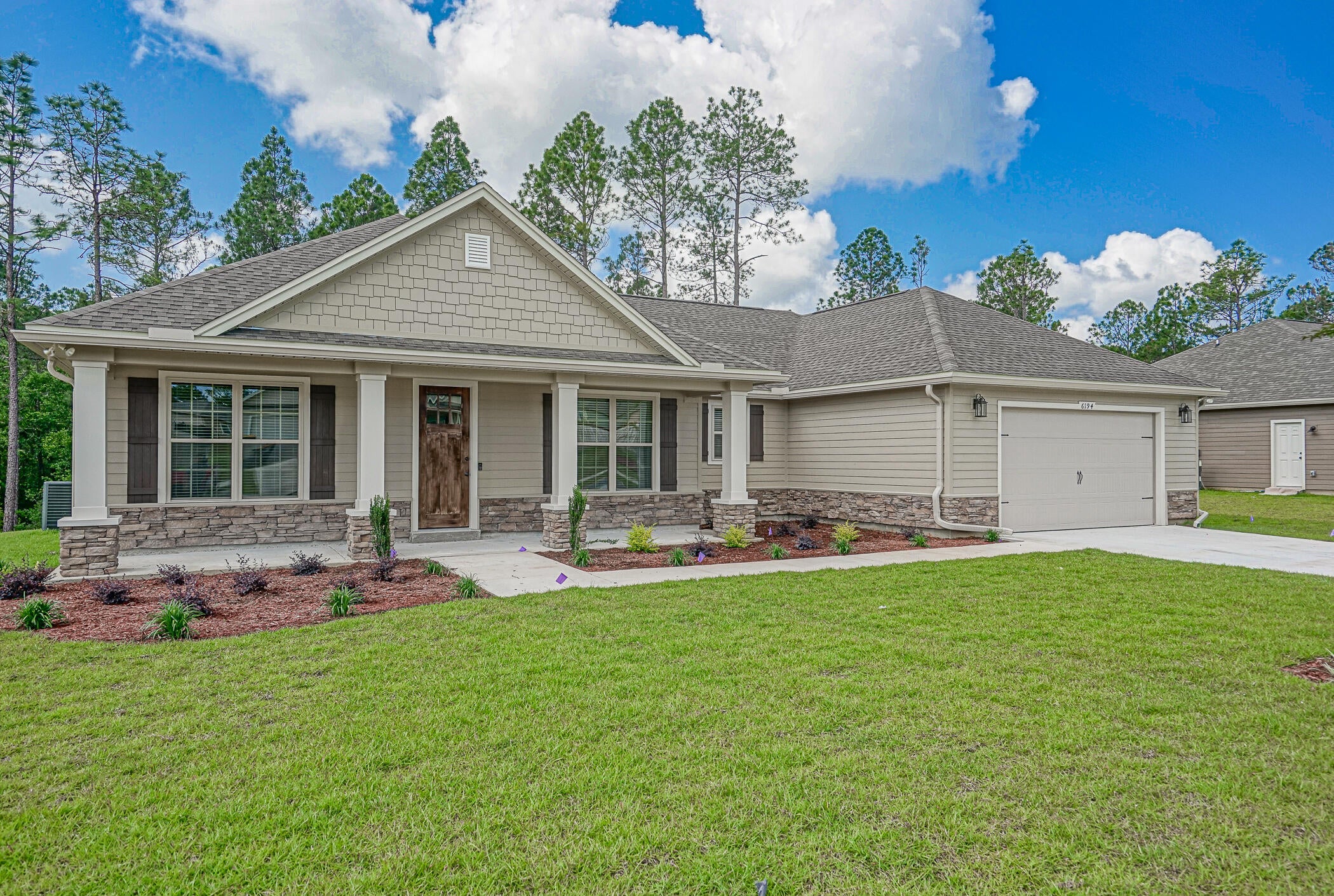 Estimated Completion date 5/15/2021. The outer appearance of this home exudes a storybook of charm. Enter through the foyer, with beautiful handscraped chestnut flooring to showcase the elegance of this home. Enjoy the wood flooring in the foyer, flex room, cafe, kitchen. Kitchen is great for entertaining with a Granite counter tops, breakfast bar, open cafe style eat-in area, and opens to the family room. The Master suite offers a gracious walk-in closet, soaking tub, separate shower, & dual spa sinks. Decorative columns, cedar shake siding & stone accent the exterior of the home. This home does not offer the bonus room.  Colors and materials are subject to change without notice. See more comments section for color selections. Pictures are of a prior built home. Subject to change without notice

Kitchen Cabinets: White, Counter tops: Granite-Biano Antico
Master Bath cabinets: Cafe Counter tops: Granite- Bianco Antico, 2 white spa sinks
Bath 2: Cabinets Cafe, Counter tops: White/White Cultured Marble
Exterior Stone: Rubble- Metro Brown
Carpet: Costello II -Chopsticks, Guest Bedrooms and Closets
Wood: Handscraped Toasted Chestnut-Foyer, Family, Kitchen, Flex/Study, Hallways, Dining, Master Bedroom and Closet,
Tile: 12x24 Vining Blanco-Baths, Utility
Hardware: Bronze
Front door: Gel-Stain Chestnut
Interior Walls: Accessible Beige
Blinds: 2" Faux ultra wood white