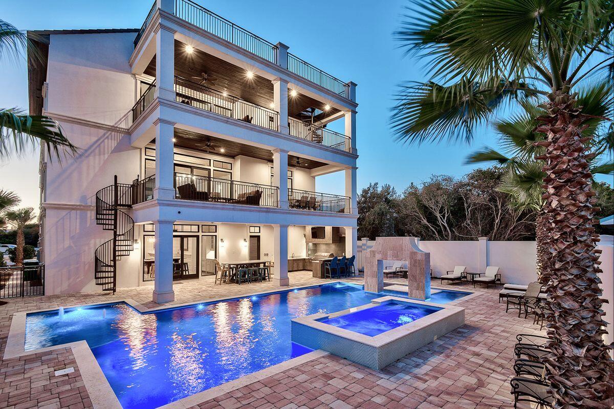 Sleek coastal contemporary design perfectly situated to capture gulf views & masterfully configured providing unparalleled amenities including a massive private resort style pool area complete with a stone waterfall feature & swim up bar as well as an adjoining spa and covered outdoor summer kitchen & living area. This is the ultimate beach house; a short-term rental machine with over $250,000 in gross annual rentals already on the books for 2022 and $380,000+ in gross projected annual rental income. This home was designed to maximize functionality and finely appointed with chic contemporary finishes while affording optimal comfort & living space. Notable features include multiple indoor and outdoor living areas, private commercial grade elevator, dual master suites with gulf views, built-in pinterest style bunk beds, indoor and outdoor surround sound system as well as security cameras for optimal privacy. The first floor layout boasts dual bunk rooms, a large bedroom with ensuite bath as well as an industrial style game room complete with a pool table & built in wet bar including a full size Sub-Zero fridge. The second floor is the focal point of indoor living space with a spacious living room featuring pecky cypress ceilings, floor to ceiling windows to soak in the beautiful gulf views, gas fireplace, built-in entertainment center and open to the massive dining area overlooking the rear amenities. The ample sized kitchen features floor-to-ceiling custom cabinetry, paneled Sub-Zero appliances and Wolf professional series gas range, walk-in pantry and large center island with gorgeous shell infused custom countertops. The second floor also features two full bedrooms with ensuite bathrooms & half bath as well as access to the second story outdoor dining area overlooking the lagoon style pool. The third floor features three full bedrooms including dual master suites with wrap around porches, laundry area as well as a fourth story viewing deck to maximize the incredible gulf and lake views that surround this prestigious home. Kokomo Kove owners enjoy deeded beach access steps from the home and centrally located near Destin's world class golfing, dining, shopping & entertainment.
