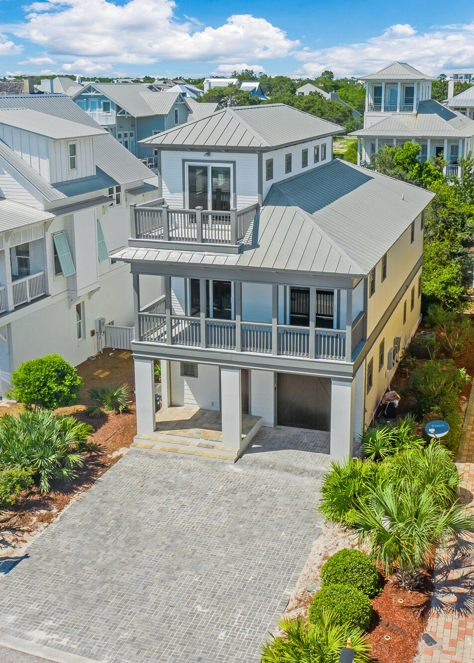 Nestled within the Barberry Coast community, just one tier off of the turquoise hued waters and white sugar sand, resides 213 Winston Lane. Spanning three levels with three bedrooms plus bunk room on the first two levels and an additional bedroom loft on the third level, this picturesque beach home features over 2,600 square feet of remodeled and professionally decorated living space with accommodations for twelve. Upon entry you are greeted with the custom reclaimed oak flooring sourced from a historic Michelin tire plant in South Carolina.  The first floor features two bedrooms, a bunk room, laundry room, and access to the one-car garage. The main living area and Chef's kitchen is found on the second level. The impact-rated sliding glass doors in the living and dining rooms showcase the idyllic Gulf views while providing access to one of four oversized porches totaling over 600 square feet of outdoor living space.

The main suite with walk-in closet, grand ensuite, and private porch complete the second floor. An additional living area boasting two sets of hand crafted bunk beds, a wet bar, and access to the porch perfect for admiring the vibrant Emerald Coast sunsets is found on the uppermost level. 

Barberry Coast is geographically poised minutes from the iconic town center of Rosemary Beach in addition to all of the world class dining and entertainment venues 30A has to offer. The low-density twenty two residence community affords residents with sought after amenities including deeded beach access and a large community pool while maintaining low HOA dues. 

The culmination of luxurious finishes and furnishings often only found in primary residences coupled with the compelling rental income potential creates a truly unique turn-key investment opportunity. Inquire today to schedule a private viewing and start living the coastal lifestyle you deserve.