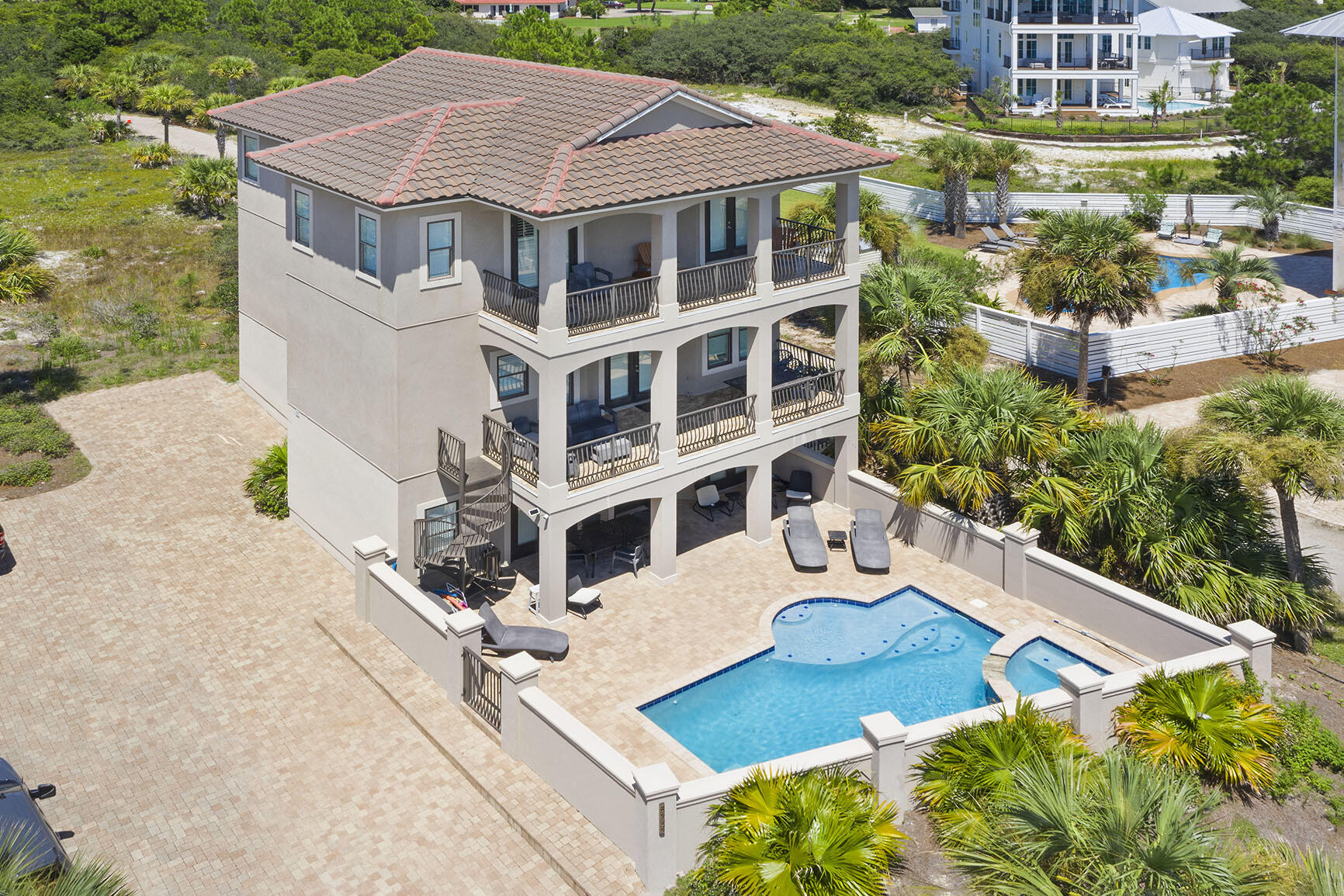 Gulf Views in Front + Coastal Dune Lake in Back = Pure 30A Perfection. 

As if this perfectly positioned 30A mediterranean beach home is not enough, this lot is so large you can add another home, pool, and mini golf course. Plans in hand and will convey!

Forever uninterrupted Gulf views with county owned facilities across the street, and the serene beauty of a coastal dune lake in the backyard, this 6-bedroom, 6.5-bathroom masterpiece offers a one-of-a-kind blend of natural luxury and architectural elegance. 

This home is both an exceptional income generator and a peaceful personal retreat with a huge value add opportunity! Other property features include: 
* Spacious covered balconies on each level
* A backyard oasis with views of a coastal dune lake, a natural phenomenon unique to this stretch of Florida's coast.
* Private pool, hot tub, and waterfalls designed for total relaxation.
* A short walk to Stinky's Fish Camp and other local favorites
The residence itself stuns with:
* Nearly 3,500 sq ft of living space across three stories
* Custom 10'-11' ceilings, sleek tile flooring, and recessed lighting throughout
* A private elevator for effortless access to every level.
Gourmet kitchen featuring granite countertops, custom cabinetry, and premium gas Dacor appliances.
* No HOA dues and incredible flexibility for primary living, a second home, or a turnkey investment.

This is 30A living at its finest  where coastal elegance meets unbeatable location, and nature's beauty surrounds you at every turn. The rarest of gems with views in both directions AND space for an addition. Don't let this opportunity slip away!