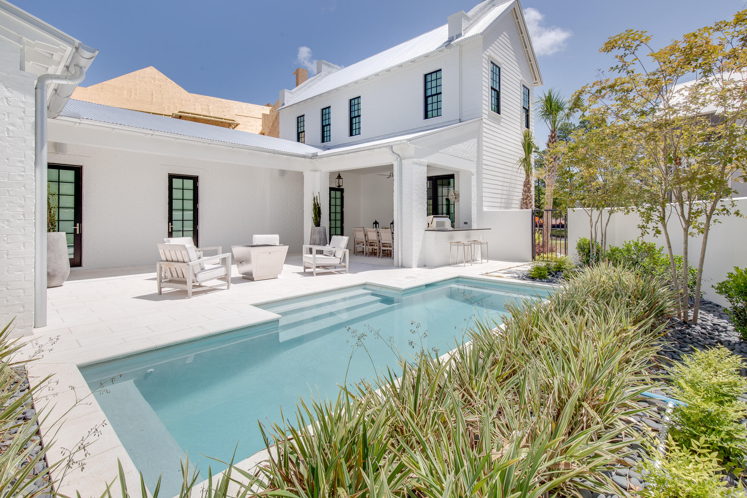 This stunning, elegantly furnished home designed by Savoie Architects is situated on a beautiful spring-fed lake within the coveted bay-front enclave of Churchill Oaks. Offering 3 bedrooms, with the master on the main level, 3 and 1 half bathrooms, a 2-car garage, and  extraordinary features such as white oak floors, mahogany courtyard door and aluminum clad windows and doors. Outdoor amenities include a private courtyard pool, summer kitchen, fire pit, outdoor living room, and a veranda with lake views. The spacious first floor has an open living area centered around a gas ribbon fireplace, and a grand dining area with a full wet bar. The chef's kitchen includes beautiful quartz countertops, shaker style cabinets, Thermador appliances, and a walk-in pantry. Don't miss this one! Tucked away amongst native vegetation and the calm waters of Hogtown Bayou, Churchill Oaks offers a lifestyle of elegance and appreciation of nature. Once inside the stately gated entrance, magnificent coastal homes accentuate southern architecture under a canopy of old oak trees. The 40-acre community is comprised of 87 homesites and some of the best amenities in South Walton. The latest amenity to the community is a deep-water, private marina. The marina project includes 36 private boat slips, paddle board storage decks, a fish cleaning station, shoreline stabilization + more! The Churchill Oaks Clubhouse is an outstanding 8,000 square foot amenity situated on a point on the Bay with stunning views. Three pools, exercise room, outdoor bar, fully equipped media room, commercial grade kitchen, bath and locker rooms, and large gathering spaces are all found at the Clubhouse for owners and their guests to enjoy. * Please verify with listing agent the total New Buyer fees due at closing.