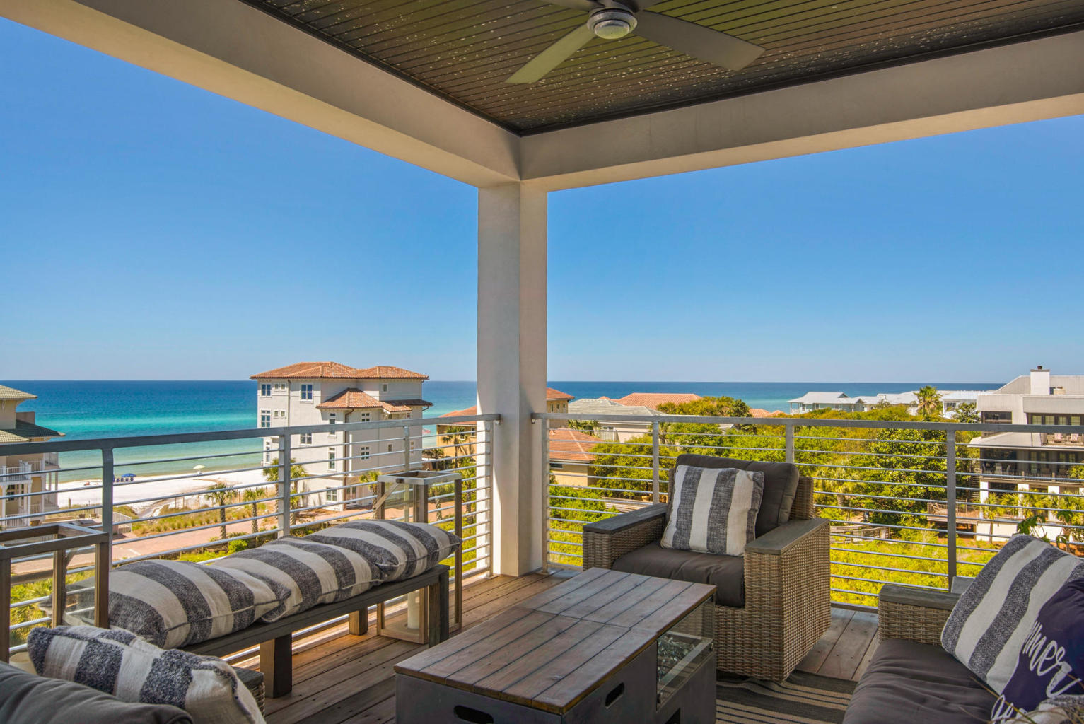 CASPIAN ESTATES! Now is your chance to own in this highly sought-after breathtaking location!  This elegant home features an oasis of gulf views and is only a short walk to the beach and is being sold fully furnished. Nestled behind a private gate with an intimate setting of nine homes. Replete with sleek materials this indoor/outdoor plan features, four stories of luxury with multiple gulf views, and two car garage. The features include raised cross beam ceilings, barn doors, hardwood, tile and concrete floors, spacious bathrooms with luxurious walk-in showers, plus an elevator for convenience to each floor. Oversized glass doors bring the outdoors in. The gourmet kitchen has a six burner gas cooktop, double ovens, custom refrigerator surround, large pantry, microwave drawer, quartz countertops and an island for more seating for six. Open concept dining room seats twelve and opens into the kitchen and living. This extraordinary beach home has personality in every room with inviting oasis views that will impress even the most discerning buyer. The top floor comes with ocean view room and large outside terrace with oversized glass doors that open to astounding gulf views and is perfect for family gatherings along with guests.  A perfect space for relaxing and enjoying the sunrise and sunsets to complete your day!