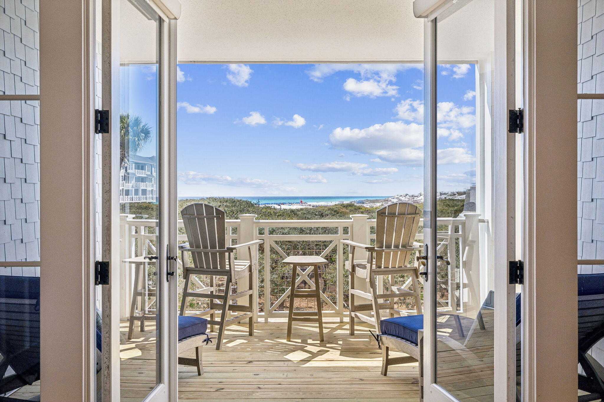 Experience exceptional GULF-FRONT living in this stunning 2-story condominium in Watersound Crossings, perfectly positioned just steps from the sugar-white dunes and emerald waters of the Gulf. Offering over 2,100 square feet of thoughtfully designed living space, this residence blends coastal elegance with comfort and functionality. The gourmet kitchen features premium Viking and SubZero appliances, a large walk-in pantry, and expansive views of the Gulf of America that continue through the dining and living areas. The first-floor primary suite provides a peaceful retreat with French doors opening to a private covered patio surrounded by lush landscaping--ideal for morning coffee or quiet relaxation. Just outside the suite is a convenient dry bar/coffee bar with beverage refrigerator, along with a spacious owner's closet, additional storage under the stairs, laundry room, and a custom bunk room with built-in storage.
Upstairs, two guest bedrooms each offer private en suite baths, plus an additional storage closet perfect for linens or games, and a half bath for added convenience. The show-stopping second-floor balcony overlooks the Crossings pool and grill area, with breathtaking views stretching to the emerald Gulf waters and white sandy beach--an ideal setting to enjoy sunset evenings.
Outdoor living flows seamlessly to the boardwalk leading to the dedicated Crossings pool, the iconic Watersound Bridge, and miles of pristine dunes and shoreline. Additional community amenities include dune lake access for paddling and kayaking, scenic boardwalks, a fitness center, multiple pools, and the rare bonus of an attached 1 car garage with additional storage. Recent assessment of $95K per unit has been paid for external repairs to siding and new decks and railings...Building C repairs are complete.