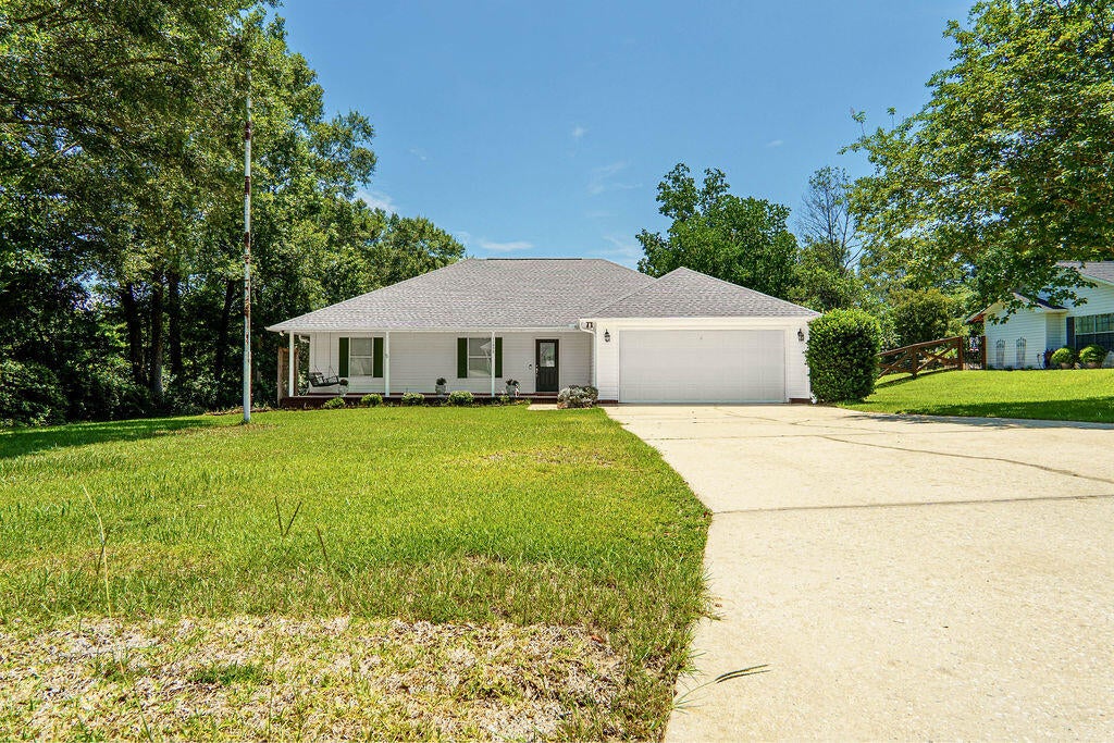 Welcome to your new home—where comfort, style, and function meet! Built in 2000, this charming 3-bedroom, 2-bath residence offers an inviting open layout perfect for both everyday living and entertaining. Step inside to be vaulted ceilings which create a bright and airy atmosphere. The heart of the home is the beautifully appointed kitchen, featuring a stainless steel gourmet stove, matching stainless steel appliances, and plenty of counter space for the chef in the family. The spacious primary suite offers a relaxing retreat, while two additional bedrooms provide flexibility for family, guests, or a home office. The dimensional shingled roof that was just replaced in 2023.  Additional highlights include a 2-car garage and a detached storage building—ideal for tools, toys, or hobby space. a detached storage buildingideal for tools, toys, or hobby space. This well-maintained property is ready to welcome you home. Don't miss your chance to own this exceptional find!