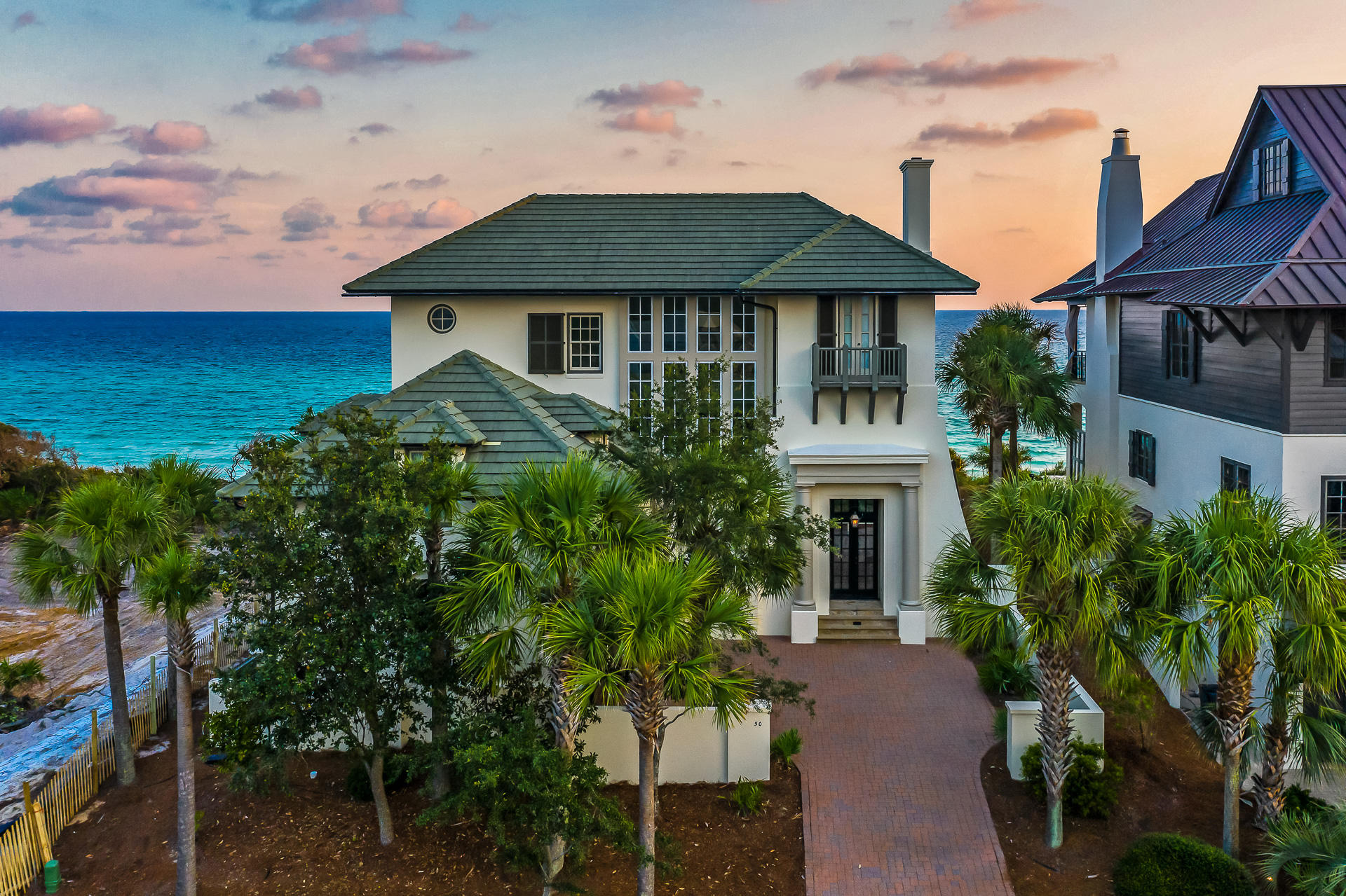 This Gulf-front home in the exclusive, gated neighborhood of The Retreat welcomes you in with unparalleled beauty and luxury. The ground-level entrance leads upstairs to a great room with an elevated, modern feel. A gorgeous dining area, complete with a stylish chandelier; divides the living room, complete with fireplace, from the striking kitchen.The great room gives way through a series of French doors to a generous porch with paver floor that overlooks the beach and Gulf of Mexico. Enjoy the stunning Gulf views while sunbathing or dining al fresco. Upstairs from the great room is the master bedroom with a private bath and large covered porch, as well as two guest bedrooms, each with its own private bath. Enjoy the four bedrooms and five bathrooms- plenty of space to spend time with family and enjoy 30a's acclaimed restaurants and dining, nightlife spots, and the beach!