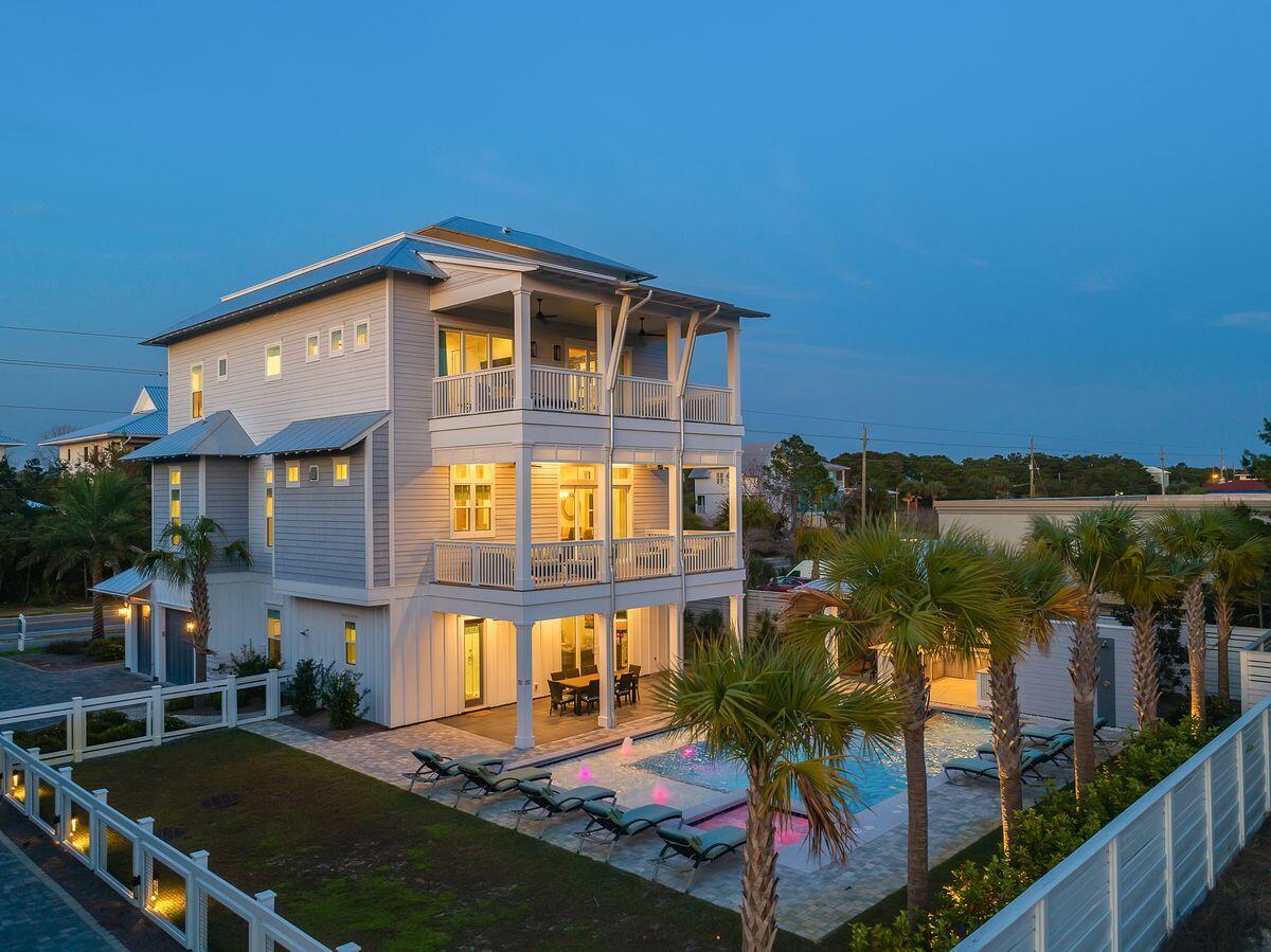 Masterfully built and thoughtfully designed, this exemplary construction built by Betterbuilt of Northwest Florida in 2018 is prominently situated on the west end of 30A and presides over an impressive elevation yielding unparalleled panoramic gulf and sunset views from the beautiful top floor open deck. Professionally rendered with coastal contemporary decor, this home was built as a legacy property, perfect for multi-generational living or as a top producing short term rental ($250K+ annual projected income) offering optimal accessibility from the private elevator which accesses all four levels as well as ample indoor and outdoor living spaces. Notable features include a beautiful outdoor oasis complete with a massive south-facing pool featuring built-in benches & dining table, covered outdoor kitchen and adjoining lanai as well as an oversized garage which offers private storage for vehicles including a golf cart and beach gear. "Family Traditions" combines open floorplan living with private suite bedrooms generously yielding 5 king suites with spa-like en-suite bathrooms and two guest bedrooms each with a private bathroom. The first floor, with access to the pool area, is complete with additional living space, bunk room, full bath, wet bar and game room for family to enjoy. The inverted layout plan offers expansive living, dining and kitchen that anchor the second level presiding over views of the pool and characterized by 12' ceilings accentuated by pecky cypress wood detail and a beautiful coastal trim application. The kitchen is fully stocked and finely appointed featuring professional series Thermador appliances, dual dishwashers, ample cabinet storage as well as an oversized center island; perfect for family gatherings. The third level offers dual master bedroom suites as well as a secondary living space with direct access to be heated and cooled fourth level which features an exemplary wet bar with direct access to the open rooftop deck designed to be a gather spot to take full advantage of southwest gulf views and premium sunset vistas. 

3959 W Co Highway 30A is perfectly situated between two gorgeous beach access points including the expansive Old Florida Beach county access with showers and bathroom facilities. This property is within walking distance of exceptional shopping and dining including the shops of Gulf Place, Shunk Gulley and a short drive or bike ride to Grayton Beach and Seaside.