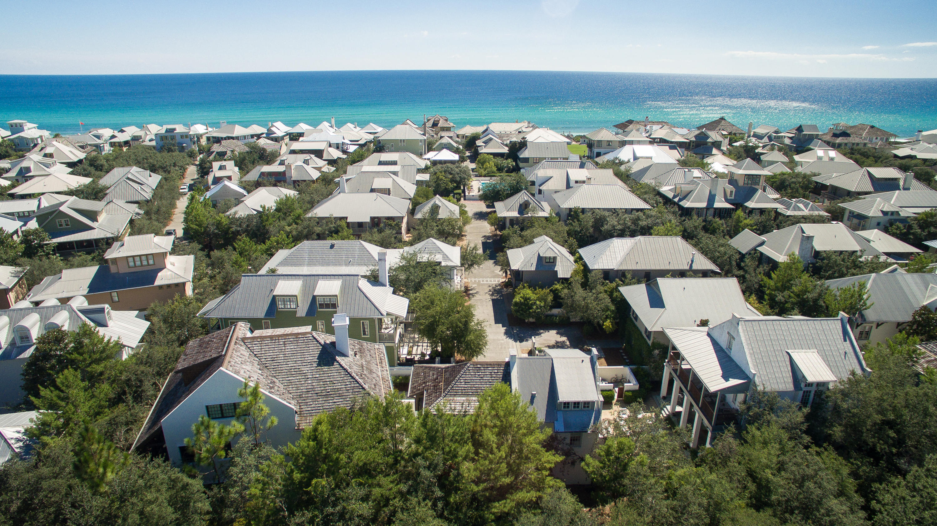One of the largest homes in Rosemary Beach with one of the best floor plans. This incredible 6 Bedroom, 7.5 Bath home also feature an incredible 3rd floor great room with gaming area and large bunk area that is equivalent to a 7th bedroom. This home was built by a prominent local builder that built many of the first homes in Alys Beach and was originally built as builders personal residence. No expense was spared in construction and the current owners have meticulously maintained the home and have never rented the home. The home is located at the end of a private street on the south side of 30A and features a 2 car garage with full 1 bedroom carriage house. The main home features a courtyard large enough for a pool. Meticulously landscaped. The home features extensive decks, an been professionally furnished.  The home is being sold fully furnished, including all artwork and with extensive window coverings.  This home is move in ready.  The perfect home for a large family, it is one of the few homes in Rosemary Beach that offers a very livable floor plan.  The home features full security system and is fire sprinklers.  The main level features a long gourmet kitchen complete with a separate side kitchen/pantry area.  The living room opens into the courtyard and has travertine floors, a large fireplace and a dining area.  The first floor also features a large master suite, a rarity in Rosemary Beach.  There is also a separate library/office on the first floor.  The second floor features 4 large bedrooms all finely furnished along with a second living room/den on the second floor, all opening onto a large covered deck overlooking the courtyard.   There is even a second floor master as well.  Two laundry areas, Main floor laundry room and an additional laundry closet on the 2nd floor.  
The huge 3rd floor features a large great room with TV and large sitting area, storage, extensive bunk beds that could be a 7th bedroom area, a full bath and even a regulation indoor shuffleboard table.  

This home must be seen to be fully appreciated and represents a rare opportunity to own a home of this size and magnitude on the south side of 30A in Rosemary Beach.  Just a short walk to the community pool, the beach and Downtown Rosemary.  The home looks like a brand new model home.  The current owners meticulously maintained the home and have recently replaced all of the HVAC units and fully painted the home.  

While the home has not been rented previously, rental projections for the home are $265,000.00 annually.  Cox Pools has completed plans for a swimming pool, if the future owner would like a pool.  This is the best home at the best price on the south side of 30A in Rosemary Beach.