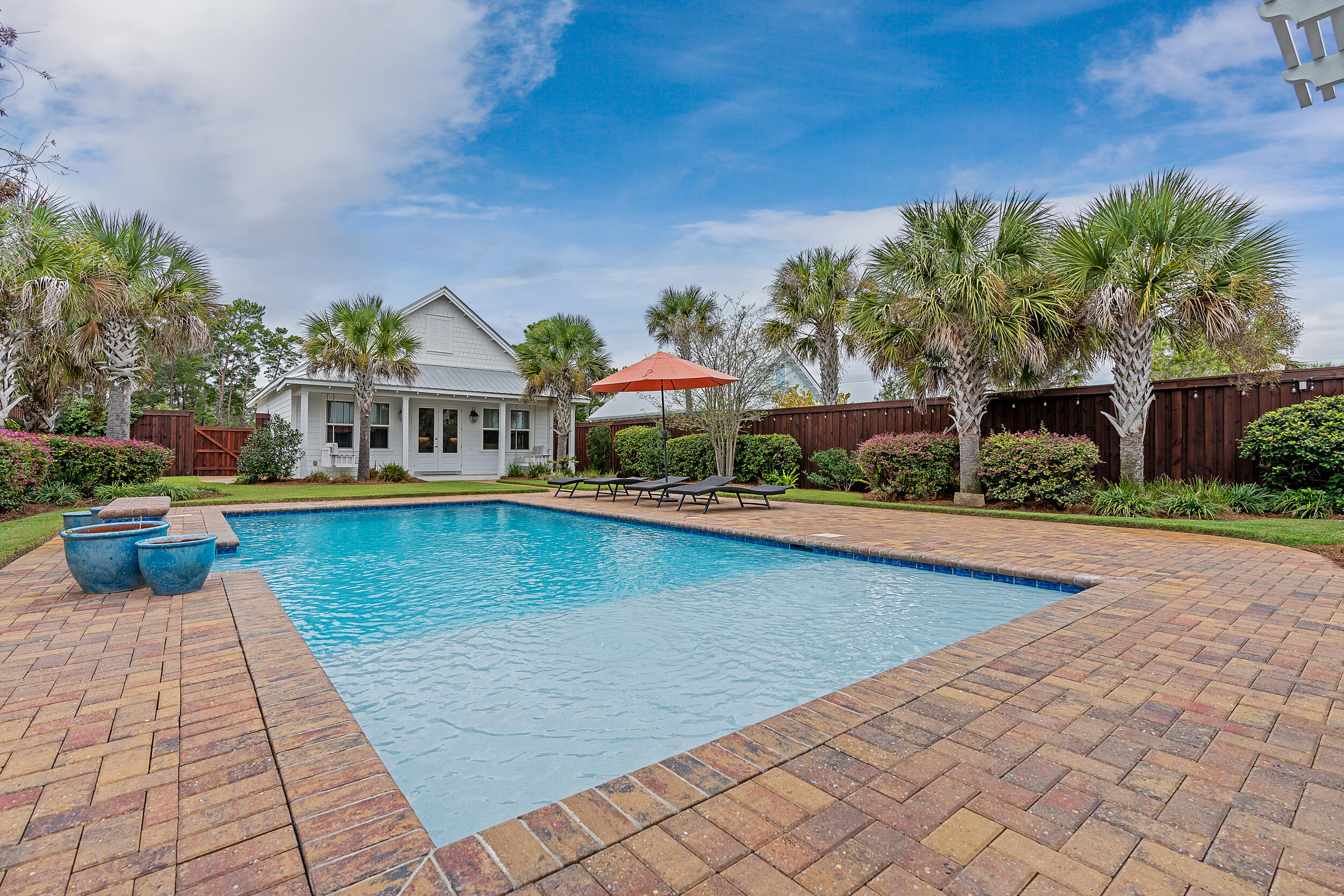 MAJOR  price improvement! This is a rare setup for 30A and priced to sell!! Welcome to 85 N Deno, a truly exceptional one-story carriage house home nestled in the heart of Santa Rosa Beach, Florida. Situated in an exclusive non-rental community, this residence offers the perfect blend of coastal living and tranquility.Carriage house residences on Deno Drive are a rare find, seldom available on the market, and often transacted off market.  Explore 30A and discover a unique opportunity - a sprawling 4,200+ square foot residence complemented by a standalone one-story carriage house featuring a garage, all set amidst a generous backyard with a pristine pool. You'll be captivated by the beautifully landscaped courtyard that connects the main house and carriage house, creating an inviting atmosphere. The main house is a showcase of comfort and style, featuring the primary suite on the ground floor with enchanting views of the meticulously manicured, serene backyard. Two additional bedrooms & baths on the ground floor ensure ample space for family and guests, providing everyone with the perfect retreat.  The heart of this home is its open and spacious floor plan, where the living room seamlessly flows into a cozy sunroom, creating the perfect environment for relaxation and entertaining. Step outside, and you'll find an oasis waiting for you - a heated saltwater swimming pool with a soothing fountain, an outdoor kitchen for culinary enthusiasts, and a pergola offering shade and charm.
Venturing upstairs, you'll discover an additional bedroom, as well as two versatile spaces currently used for sleeping but easily transformed into a media room or storage area, offering endless possibilities for customization.  The carriage house, accessed by car from the alley, boasts an additional garage, a convenient laundry room, and a spacious living and kitchen area with a separate bedroom and bathroom. This space is ideal for hosting out-of-town guests giving everyone their own space. .
This home has been meticulously maintained by its one owner and primarily used as a second home, this property exudes pride of ownership. With the beach within walking distance and local dining favorites like Shunk Gulley, Papa Surf, Perfect Pig, and shopping just a leisurely stroll away, the location is a dream come true. Don't miss your opportunity to make this remarkable property your own. Experience the best of coastal living in a serene, non-rental community. Schedule your showing today and make 85 N Deno your forever home.