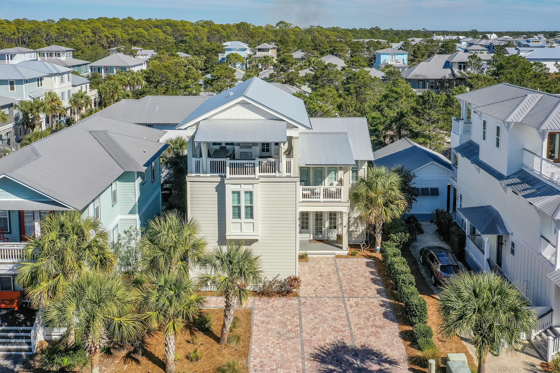 Under contract - Accepting backup offers
This beautifully designed and decorated home is the perfect beach getaway for the entire family to enjoy! As one of the largest homes in the neighborhood, this spacious 5 bedroom sanctuary includes a Bunk Room, 5 full baths, and 2 a half baths- one on the 1st level and one on the 3rd level. Multiple upgrades have been added to the home including newly painted exterior, a water softener, floor to ceiling lockable cabinets in the mudroom, lockable cabinets in the living room on the TV wall, and a wine rack with drawers and shelving just off the kitchen. Additional upgrades include a Sonos music system, a beautiful Travertine Tile patio in the back of the house with lots of seating and space for entertaining, a new ceiling fan under the overhang, a built in gas fire pit providin coziness in the evening, and a new gas connection and gas grill to show off your grilling skills. Bring those culinary skills into the gorgeous open concept kitchen that features a large island with an ice maker and breakfast bar, an extra large stainless steel gas range, modern style vent hood, stainless steel appliances, white shaker style cabinets and black granite countertops. Opening into the dining and living room, there's plenty of space for everyone to enjoy conversation and laughter while whipping up some eats! Complementing the impeccable decor, you'll find gray stained oak floors, imported tile flooring, designer furniture, and a natural gas fireplace. Upstairs is just as impressive! On the second level you'll find a comfortable lounge area with a TV, and on the third level is a game room, including a newly installed gaming connection, and a separate media room for enjoying game nights and watching movies. Also on the third level, you'll find a perfect oasis in the oversized outdoor living space that boasts of yet another gas grilling station for ease and convenience, large sectional seating for comfortable lounging, and is completed with an extra large outdoor dining area providing an abundance of room for everyone to gather, rain or shine! It's also the perfect place to relax and visit while taking in some sunset views with a glass of wine or your favorite beverage.
Also, if you don't need a garage, you can convert it into a workout room, "man cave", workshop, art studio, on-site storage, or additional rental room as you desire. The owner's have put much thought and detail into this inviting home!

Located in the sought after community of Seacrest Beach and snuggled between Alys and Rosemary, this home is in the perfect location for just about anything! Surrounded by endless dining, shopping and entertainment, your family can always find something to do. It's only a 5 minute walk to the beach, or you can hop on the complimentary shuttle service that runs seasonally, allowing for an easy ride to carry your beach gear and family. Opting for no sand? You are just steps away from the 12,000 sq. ft. lagoon pool. 

Don't miss out on your perfect beach house or incredible investment opportunity that will produce immediate income!