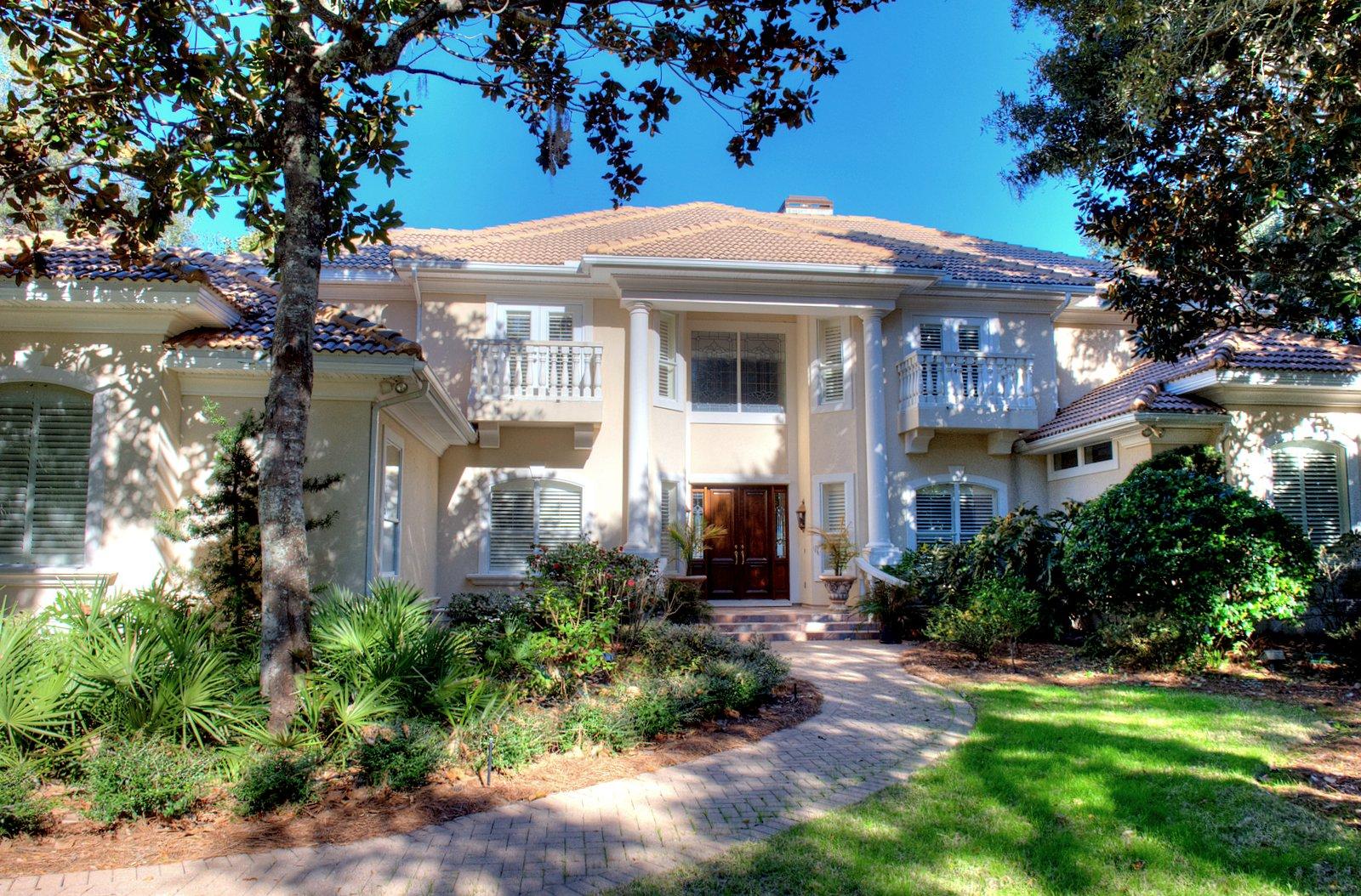 NEW PRICE! Motivated Seller says ''Bring me an offer!'' Rare find! Stunning 5BD/4+3BA custom home with expansive bay views AND on deep water! There are only a handful of homes in Destin that offer these views and deep water at the end of your private dock! Meticulously designed for gracious, comfortable living with a large foyer opening to the bay view living room that features soaring 22 foot ceiling, gas fireplace with impressive mantle and disappearing four panel glass sliding doors opening onto the screened lanai. Adjacent to the living room is a generously sized formal dining room and convenient butler's pantry, complete with sink, ice machine, wine cooler, built-in wine rack, custom cabinetry with leaded glass doors. A handsome library/study is just off the foyer and has custom built-in bookcases and cabinetry.  Everyone will enjogathering in the spacious, open leisure room/kitchen/casual dining area which also has bay views and direct access to the lanai.  Any cook is going to love this kitchen, with abundant cabinet space and extra long breakfast bar, tumbled marble back splash, large center island with vegetable sink and disposal, upgraded appliances including gas cooktop, stained glass cabinet fronts, sunny window over the sink which is also a convenient pass through to the courtyard and grilling area, built-in desk/computer area with two seating areas.  The leisure room has custom built-in bookcases, gas fireplace and an entire wall of windows facing the water.  Luxurious waterfront master suite with large bedroom, his and hers walk-in closets, linen closet, sumptuous bath with his and her vanities, private water closet with bidet, large walk-in tiled shower, large jetted tub.  Also on the first level is the laundry center/sewing room, with two storage closets and deep sink.  On the second level are four very generously sized guest bedrooms, two sharing a Jack and Jill bath and the third bedroom sharing a bath and a half with a spacious dorm room that's large enough for several sets of bunks and play area for the kids.  Juliet balconies are off the south facing bedrooms, while the bay front bedrooms offer large, private balconies with retractable screen doors to let the bay breezes in!  There are so many custom and architectural features in this beauty including raised, trayed and coffered ceilings, deep crown molding, art and recessed lighting, travertine floors, stained glass transom window and cabinet fronts, custom built-ins, surround sound on the entire first level and outdoor living area, whole house water filtration system, recirculating hot water system for the first level.  Excellent storage space throughout the home.  Oversized three car garage with pull down stair attic storage, hurricane shutters. Large screened outdoor living area with heated salt water pool and oversized spa.  Private dock on deep water, just at the mouth of the channel entrance to Indian Bayou. Relax on the lanai and watch the boats go by!  Extremely well maintained home!  Lush, mature landscaping on one of Kelly Plantation's premier water front lots!  Not in a flood zone, so flood insurance is not an issue.  A must see for the discriminating buyer!  Don't let this one get away!  As always, all dimensions important to the buyer should be verified.  With the right offer, seller would consider including 2001 Cruisers 35 foot Express BR7160, with low hours (1150) and in excellent condition.  One owner, kept on a lift, new canvas, new upholstery, new electronics!