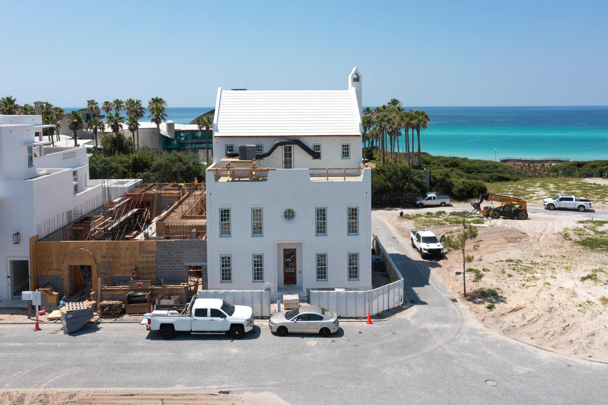 One back from Gulf Front, this Chancey Architecture designed Alys Beach home offers forever water views from its 5,356 square feet of conditioned living space. With an anticipated completion in November of 2024, this is a rare opportunity to own a new construction custom home this close to the beach in Alys Beach. 

To optimize water views, the kitchen, living, dining and loggia area as well as the pool and pool house are elevated to the second floor. The third floor is comprised of a large outdoor rooftop terrace at the front of the house, which overlooks the Town of Alys Beach, and an additional southern facing rooftop terrace and spacious Master Bedroom Suite look out to the beach and water views of the Gulf of Mexico. There is elevator access to all three floors. A large two car garage and 851 square feet of enclosed storage takes care of all storage needs. 
Upgraded finishes, fixtures and appliances are found throughout this home. A full furniture package has already been selected for the home by Chancey Design and may be purchased separately.