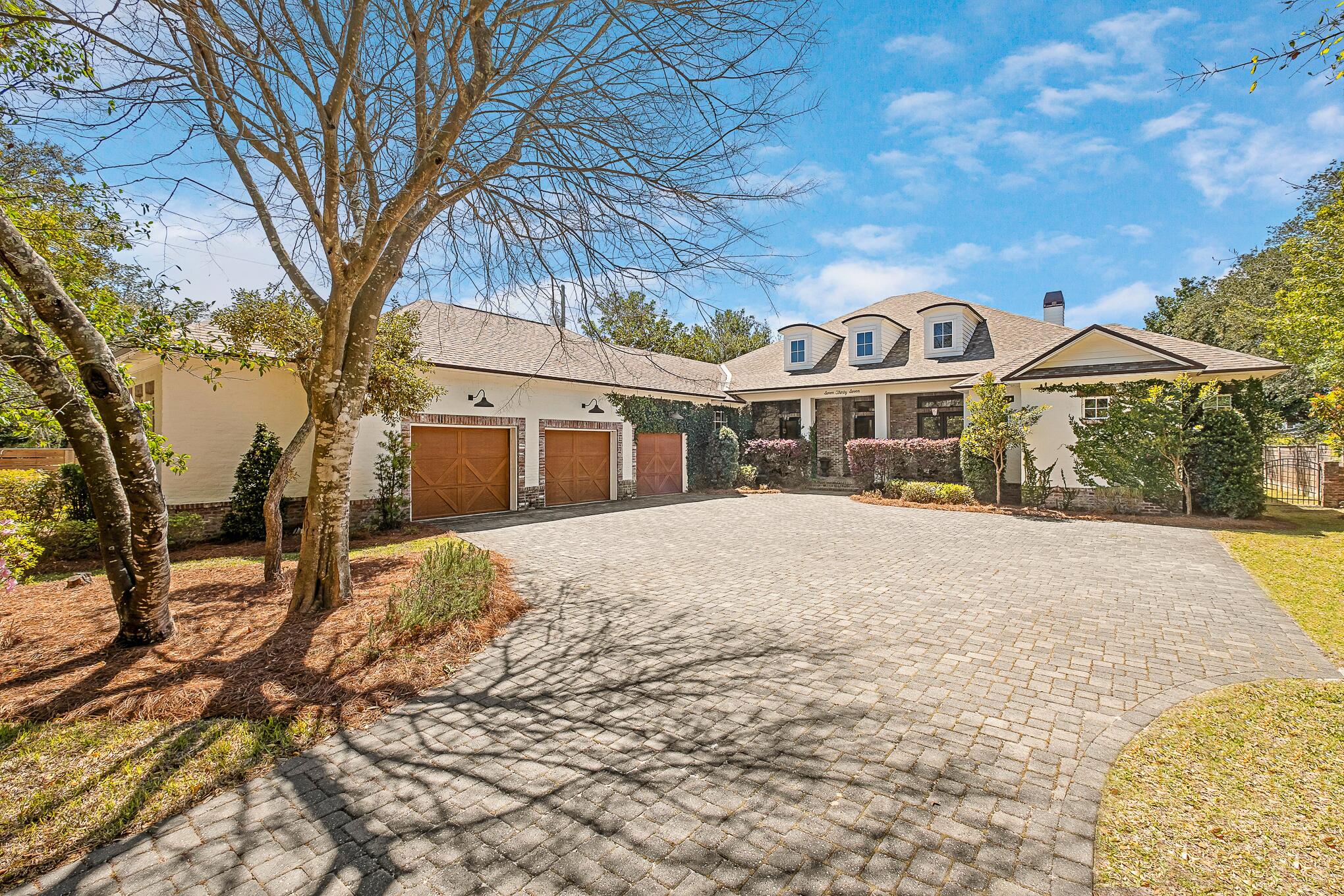 Introducing an unparalleled opportunity to acquire one of Destin's most distinctive waterfront estates—a custom-designed masterpiece nestled on .92 acres of protected deep water frontage in the highly coveted enclave of Joe's Bayou. This remarkable residence, elevated more than 20 feet above sea level, was thoughtfully crafted in 2018 and offers a harmonious blend of timeless Southern elegance and refined modern design, all executed to the highest standards of architectural excellence. 

Set at the end of a private, tree-lined drive, the approach to the home instantly conveys a sense of arrival—one that sets the tone for the bespoke luxury that awaits inside. Upon entry, you are greeted by an ambiance of sophistication and warmth, created by the combination of aged French Oak flooring, custom-designed millwork, and wall-to-wall glass that bathes each room in natural light and frames uninterrupted views of the serene bayou waters.

The heart of the home is the gourmet chef's kitchen, a culinary haven outfitted with top-tier Thermador appliances, elegant quartz countertops, bespoke inset cabinetry, and an impressive butler's pantry. Whether hosting a formal dinner or preparing an intimate meal, the kitchen flows seamlessly into the artfully appointed formal dining room, where an exquisitely designed ceiling and curated lighting create the perfect backdrop for elevated entertaining.

Designed with both comfort and grandeur in mind, the expansive master suite occupies its own private wing in the northwest corner of the residence. Here, tranquil waterfront views and refined finishes create a peaceful sanctuary. The spa-inspired ensuite bathroom boasts a luxurious soaking tub, dual vanity, an oversized walk-in shower, and his-and-hers custom-designed closets, each offering tailored organization and timeless style.

Transition effortlessly to the outdoors, where the Florida lifestyle comes to life in the home's resort-style amenities. An expansive covered open-air veranda leads to a heated saltwater pool and spa, surrounded by hand-laid brick pavers and lush landscaping that ensures both beauty and privacy. A fully equipped summer kitchen makes alfresco dining and entertaining a breeze, while the oversized dock, complete with dual boat lifts and a dedicated jet ski lift, provides unmatched access to Crab Island, East Pass, and the open waters of the Gulf of Mexico...a true boater's paradise.

Additional Distinctive Features Include: Two private home offices, perfect for today's work-from-home lifestyle, Extended three-car garage with room for storage, golf cart, or hobby space. A spacious upstairs guest suite with a private bath, offering flexibility as a media room, gym, playroom, or private retreat. Abundant, discreetly integrated storage throughout the home, No HOA restrictions and ideally located in an X Flood Zone (no flood insurance required)

Situated in one of Destin's most esteemed and peaceful residential pockets, this estate provides a rare combination of exclusivity, security, and accessibility. Just minutes from fine dining, boutique shopping, world-class golf, and white-sand beaches, yet tucked away in a sheltered harbor, this is a residence that offers both sanctuary and sophistication.

This is not merely a home, it is an heirloom property, a place to gather, to celebrate, and to make memories that will last for generations. Whether you seek an idyllic retreat, a showpiece for entertaining, or a legacy asset to be cherished, this exceptional estate in Joe's Bayou delivers on every front.

Now is the time to make your mark on the Emerald Coast. Schedule your private tour today and experience the pinnacle of waterfront living.

VIEW VIDEO TOUR: 
https://docsend.com/view/exysvnyw5yswvepn