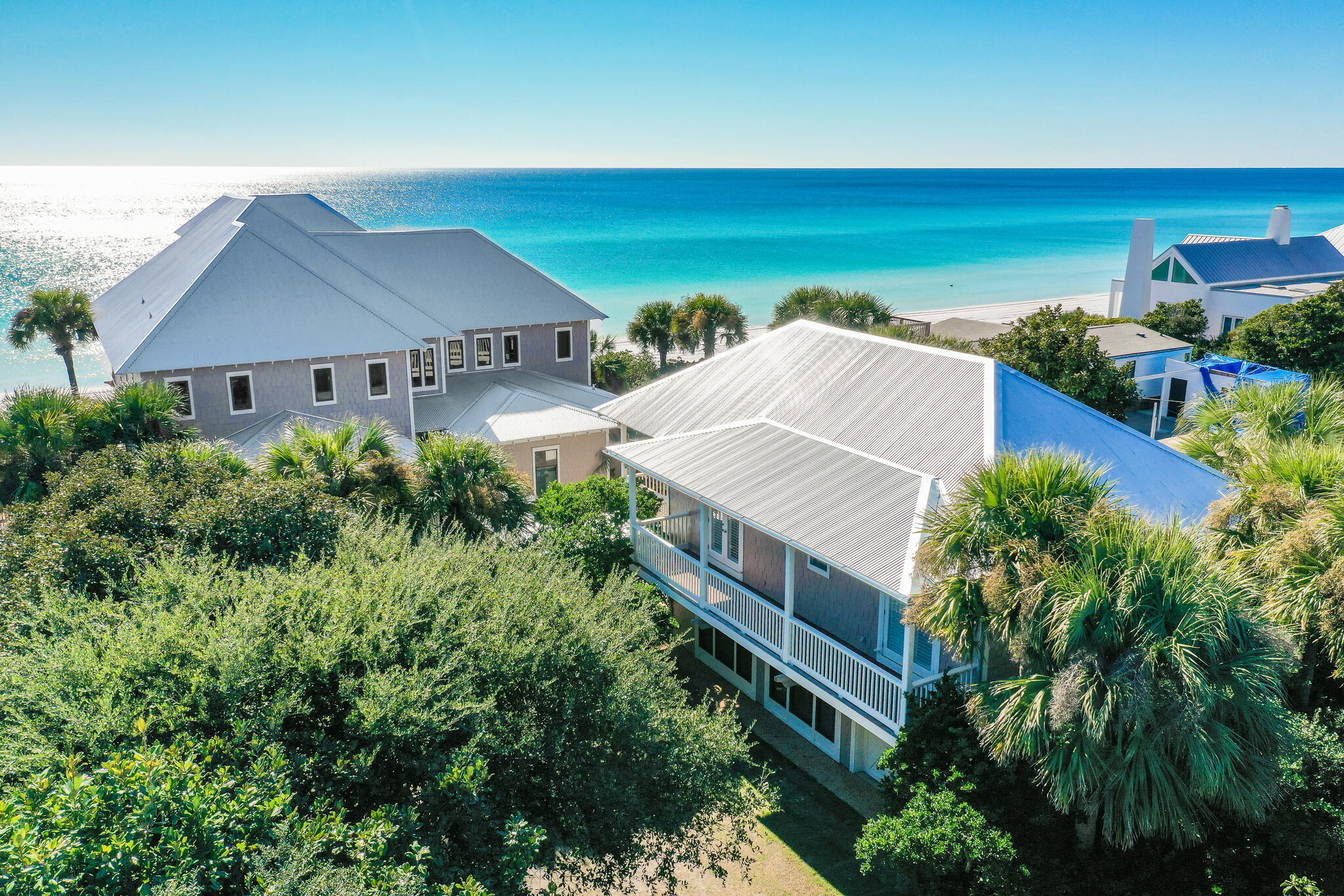 Gulf Front Privacy - Iconic property - First time offered for sale - Nestled in the coveted neighborhood of Beach Highland, where turnover is rare and so are the crowds, you will find this peaceful property approximately 26' above sea level with 100' of private beach frontage. The home enjoys almost 9,000 sq. ft. under roof (6,545 sq. ft. heated/cooled sq. ft. & 2,452  porches). The main home has five bedrooms, five full baths, and one half bath. The carriage house has three bedrooms, three full baths, and a bunk room. Additionally, there is a resort-style pool and a hot tub, all in a very private coastal setting. Designed by renowned architect Matthew Savoie, 23 Highland Ave is a captivating residence to enjoy for generations. Enter the private, gated paradise among lush, mature trees and vegetation. The main house features a large open living area and four Gulf-front bedrooms, including a spectacular master retreat. The master includes a large bathroom, two walk-in closets, a coffee bar, a fireplace, a living area, and access to the workout bonus space. A fifth bedroom includes four built-in full bunk beds. A warm, peaceful, grand entry with twelve-foot ceilings naturally leads you to the Gulf, where some of the most breathtaking porches, decks, and views on Scenic Hwy 30A reside. Well-appointed with attention to detail throughout, this home takes full advantage of 100 feet presiding over the white sand beach and spectacular water of the Emerald Coast. On the upper level of the carriage house, there are two bedrooms, two bathrooms, a spacious family room, a kitchenette, laundry, and porches with Gulf, pool, and courtyard views. The lower level in the carriage house features a living room, kitchenette, laundry, bedroom, bunkroom, and garage. The main house and guest quarters layout are ideal for maintaining space and privacy for a large gathering at the beach. The oasis pool and separate hot tub are very generous in size and keenly positioned for privacy in the abundant and mature landscaping while offering a gulf-front presence. World-class surf fishing is just steps away from the front door, or take a stroll down the beach to enjoy Stallworth Lake and miles of the tranquil beauty of Topsail Park Preserve. Superior construction, high elevation, a seawall, 100' on the Gulf, and property ownership to the mean high water line are features that will catch the eye and check the boxes for the most discerning of buyers. A new roof was installed in October 2022. All information is believed to be accurate but should be verified.