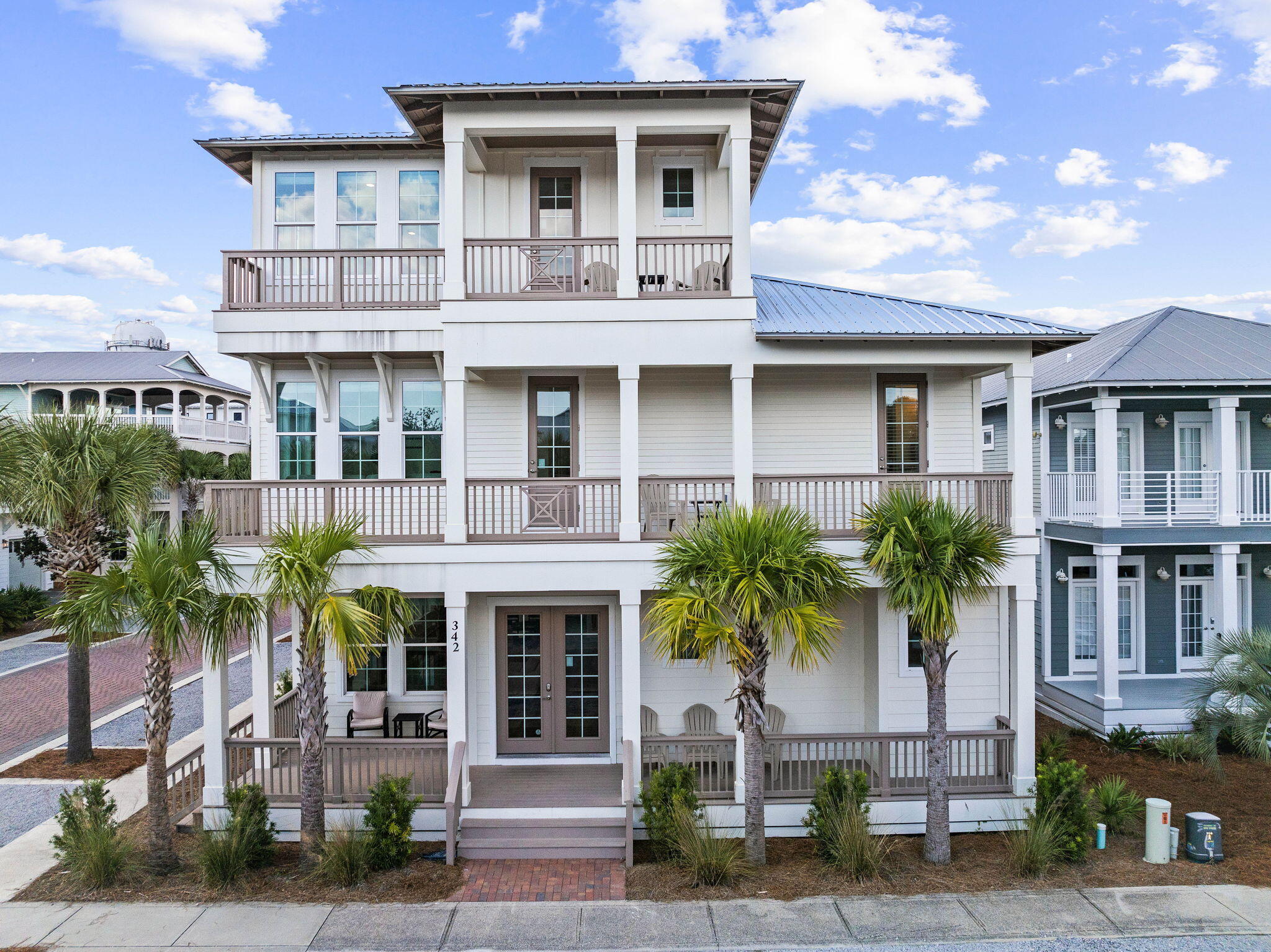 Introducing an exceptional new construction home, masterfully designed by J. Michael Hunnicutt and built by Gary Bailey, located in the heart of Seacrest Beach, just minutes from Rosemary Beach and Alys Beach. This stunning property offers one of the largest floor plans in the community showcasing luxurious finishes and thoughtful attention to detail throughout. Upon entry, you're welcomed into an expansive, open-concept living area perfect for both daily living and entertaining. Vaulted ceilings with exposed wood beams, custom bar area, and an inviting fireplace anchor the space, while the kitchen boasts high end appliances, quartz countertops, and a generous island perfect for gathering with family and friends. Adjacent the dining and living areas, you'll find a spacious patio perfect for alfresco dining and entertaining by the private pool.

The first of two primary suites is conveniently situated on the main level, featuring an en-suite bathroom with a soaking tub, dual vanities, and a large walk-in shower. The second-floor primary suite is equally impressive, offering private access to a generous balcony equipped with an outdoor TV, perfect for entertaining or relaxing outdoors.

The second floor features a massive guest bedroom fitted with three bunk beds, creating the perfect retreat for families or groups. This thoughtful design makes the home an incredible investment opportunity for those interested in short-term rentals, as it allows for maximum guest accommodation and comfort. Additionally, a cozy den on this floor offers extra living space, ensuring ample comfort for all guests.

The third level is also designed for entertainment, featuring a spacious bonus room ideal for a media lounge or game room with a custom built in bar. With 628 square feet of porches spanning three levels, this home is made for outdoor livingwhether relaxing by the private pool or enjoying stunning views of Seacrest Beach.

Additional features include a generous garage with ample storage, and an additional flexible bonus room above the garage that can be used as an office, gym, or additional guest sleeping space. Located in the vibrant Seacrest Beach community, this home offers access to a 12,000-square-foot lagoon-style pool, 1.3 miles of trails, and convenient tram service to the white sand beaches of 30A.