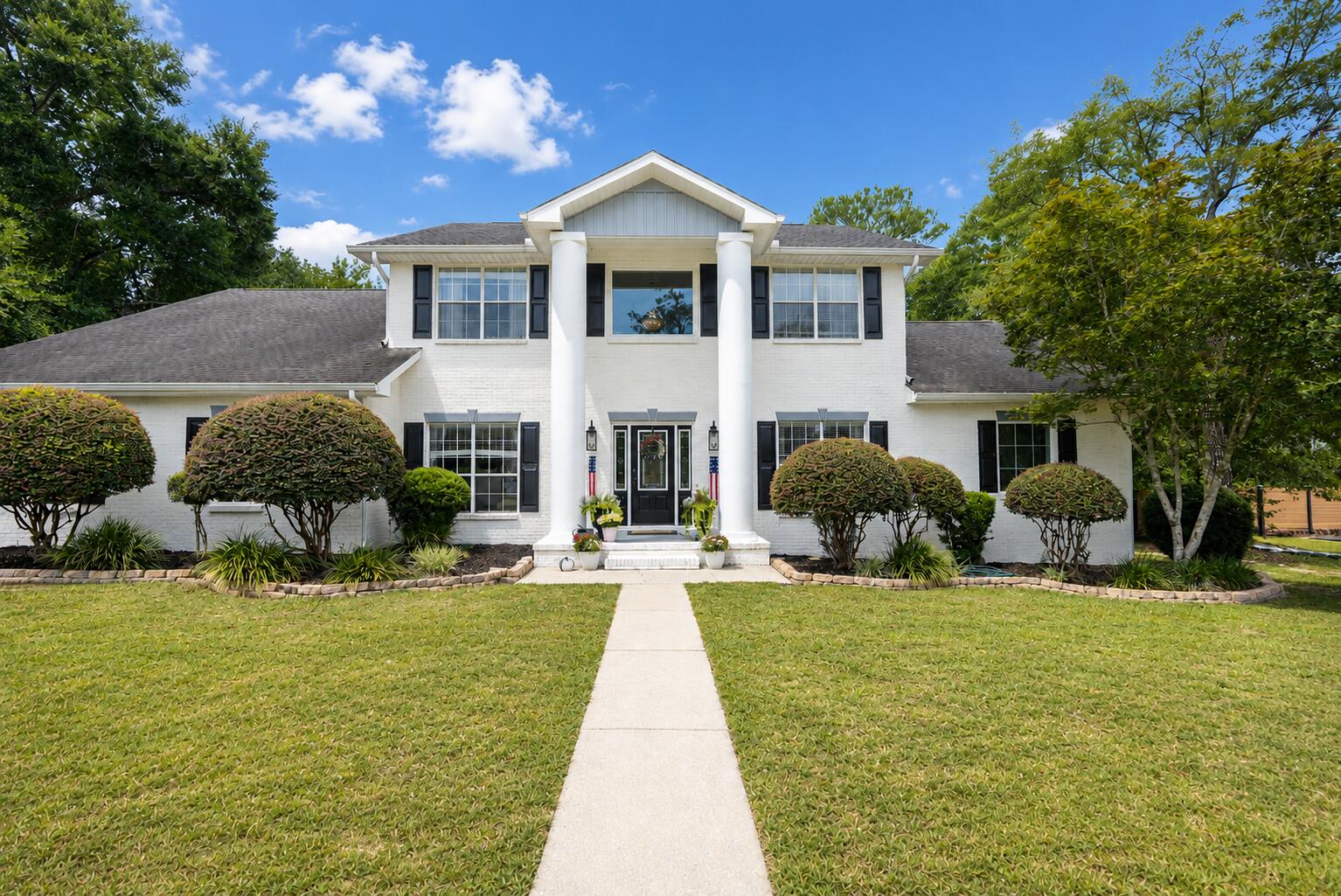 Welcome to this beautifully updated Colonial-style home situated on a picturesque one-acre lot in the Ashley Place community of North Crestview. Offering 3,692 square feet of thoughtfully designed living space, this five-bedroom, three-and-a-half-bath residence blends classic architecture with modern updates.
From the moment you arrive, the stately brick exterior, grand columns, and circular driveway create a striking first impression. Inside, spacious living areas are designed for both everyday living and entertaining. Two separate living rooms, each featuring a built-in electric fireplace, provide flexible spaces for relaxing, hosting guests, or creating a media room, home office, or hobby space.
The functional kitchen flows seamlessly into the surrounding living and dining areas, creating an inviting setting for everyday meals and special occasions. Throughout the home, custom trim work, raised-panel wainscoting, and updated finishes showcase quality craftsmanship and timeless character.
The spacious primary suite offers a peaceful retreat, while four additional bedrooms provide flexibility for guests, a home office, or additional living space. Recently updated bathrooms and a refreshed laundry room add style and convenience.
Step outside to enjoy the beautifully enhanced outdoor living area. A brand-new Trex deck and custom paver patio overlook the expansive backyard, offering plenty of space for outdoor dining, entertaining, gardening, or simply enjoying the surroundings