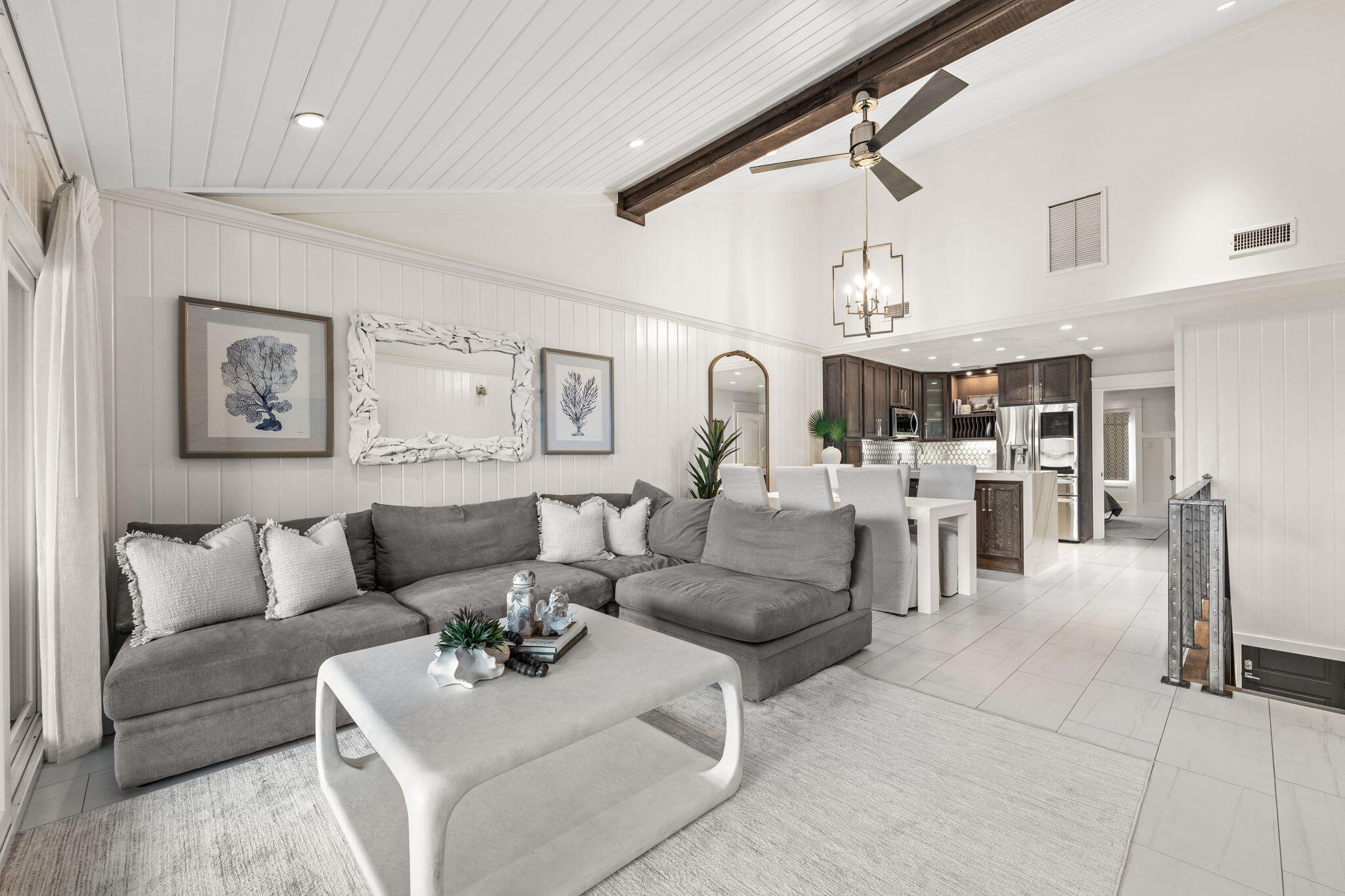 Boat or beach - you don't have to choose. Set waterfront along the protected canals of the Destin Harbor, 109 Durango Road pairs a private boat slip with a 20,000-lb boat lift, currently accommodating a 35-foot boat, and walking distance to Holiday Isle's private beach access. Completely transformed by a local design team, this three-bedroom, three-bath waterfront townhome feels less like a typical townhouse and more like a curated coastal retreat designed around life on the water.
Custom white oak cabinetry and millwork, Venetian plaster, Italian and Moroccan tile, quartz surfaces, designer lighting and fixtures, and rich Ipe decking create an elevated finish rarely found in this location at this price point. The first-floor primary king suite opens to a private waterfront terrace just steps from the boat slip and features a spa-like bath with jetted tub and separate shower. Custom white oak barn doors and fitted built-ins continue throughout all closets in the home, while an additional king suite with ensuite bath completes the first level.
Upstairs, the home opens dramatically into a light-filled living, kitchen and dining space with wide-open sightlines and an unexpectedly generous sense of scale. The kitchen is anchored by mitered-edge waterfall quartz countertops, custom-milled white oak cabinetry and a striking marble backsplash, while Venetian plaster adds another layer of texture and refinement. A wall of glass doors extend the living space onto an expansive waterfront terrace that feels like a destination of its own. Multiple conversation and lounge areas create room for entertaining or unwinding, while a full summer kitchen with quartz countertops, built-in grill and refrigerator makes outdoor living effortless. Sleek glass railings preserve the open water views and reinforce the modern coastal aesthetic found throughout the residence. A flexible third bedroom adds a custom queen Murphy bed surrounded by built-in shelving and drawers, allowing the space to transition easily between guest accommodations and additional living space.

But perhaps the greatest luxury here is how effortlessly the water becomes part of everyday life. Start the morning with coffee and a quiet cruise through the Destin Harbor. Spend the afternoon anchored at Crab Island, head offshore through East Pass for a day of Gulf fishing, or leave the boat behind and make the short trip to the beach. As the day winds down, take the boat out for a sunset cruise, pour a glass of wine and watch the harbor lights come alive. 

Few Destin waterfront properties bring together this level of design, private boating access and proximity to a private beach. A special harbor deserves a special residence. This is waterfront Destin living reimagined.