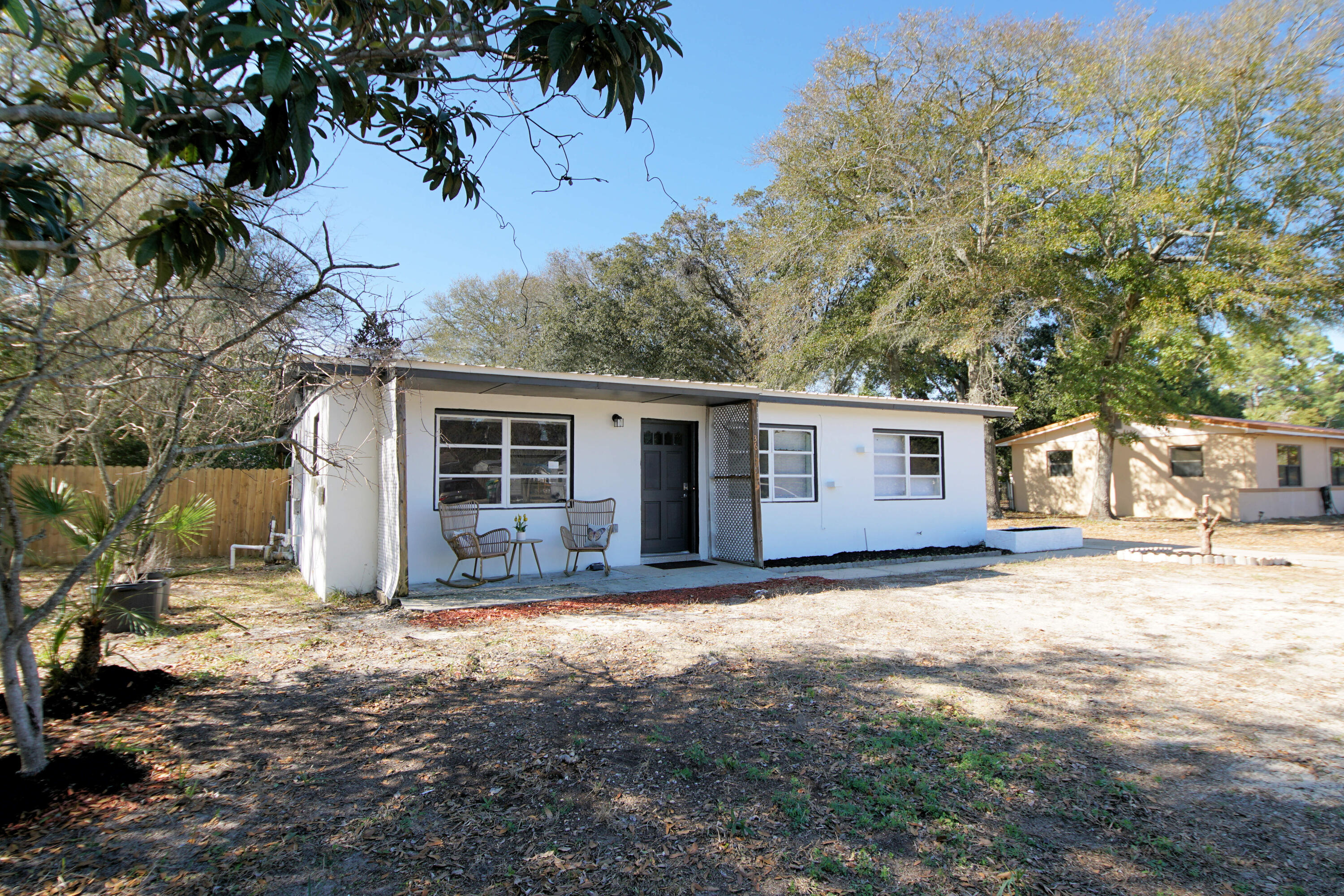 Renovated 3 bedroom and 2 bath home with 1224 Sq ft located less than one mile from the Santa rosa Sound! This home has a metal roof, hot water heater (2012), and has been rewired (2023) to include:  new outlets, switches, lighting and smoke detectors! The interior renovations include a new kitchen with quartz countertops and backsplash, under mount sink and brush nickel faucet. White shaker custom cabinetry was installed with new brushed nickel hardware. There are new black and stainless appliances to include a dishwasher, stove/oven, built in microwave and refrigerator. The home features new luxury vinyl plank flooring throughout! The bathrooms have been renovated.  The primary bedroom has an ensuite bathroom with a walk in shower.