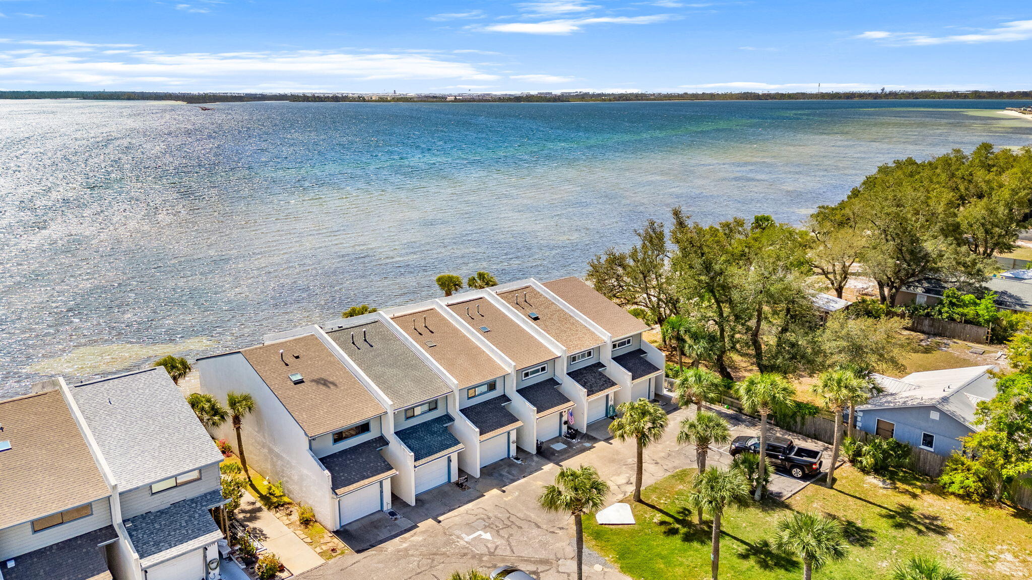 Seller will contribute $5,000 towards Buyers closings costs! Welcome to Sunbay Townhomes, a rare chance to own a versatile property with prime visibility and beautiful water views in Panama City. Perfectly positioned along a high-traffic corridor, this property offers endless potential whether you're looking for a primary residence, investment opportunity, or a unique live/work setup. Enjoy stunning sunrises over the water and the convenience of quick access to Tyndall Air Force Base, shopping, dining, and downtown Panama City. Inside, the home features a functional layout ready for your personal touch. Large windows invite in natural light and showcase the peaceful surroundings, while the outdoor space offers plenty of room to relax, take in the coastal breeze while you walk on the beach. Whether you're an investor, business owner, or homeowner looking for a property with character and potential, this one checks all the boxes. Don't miss your chance to own a piece of the coast with high visibility and endless possibilities, book your private showing today.