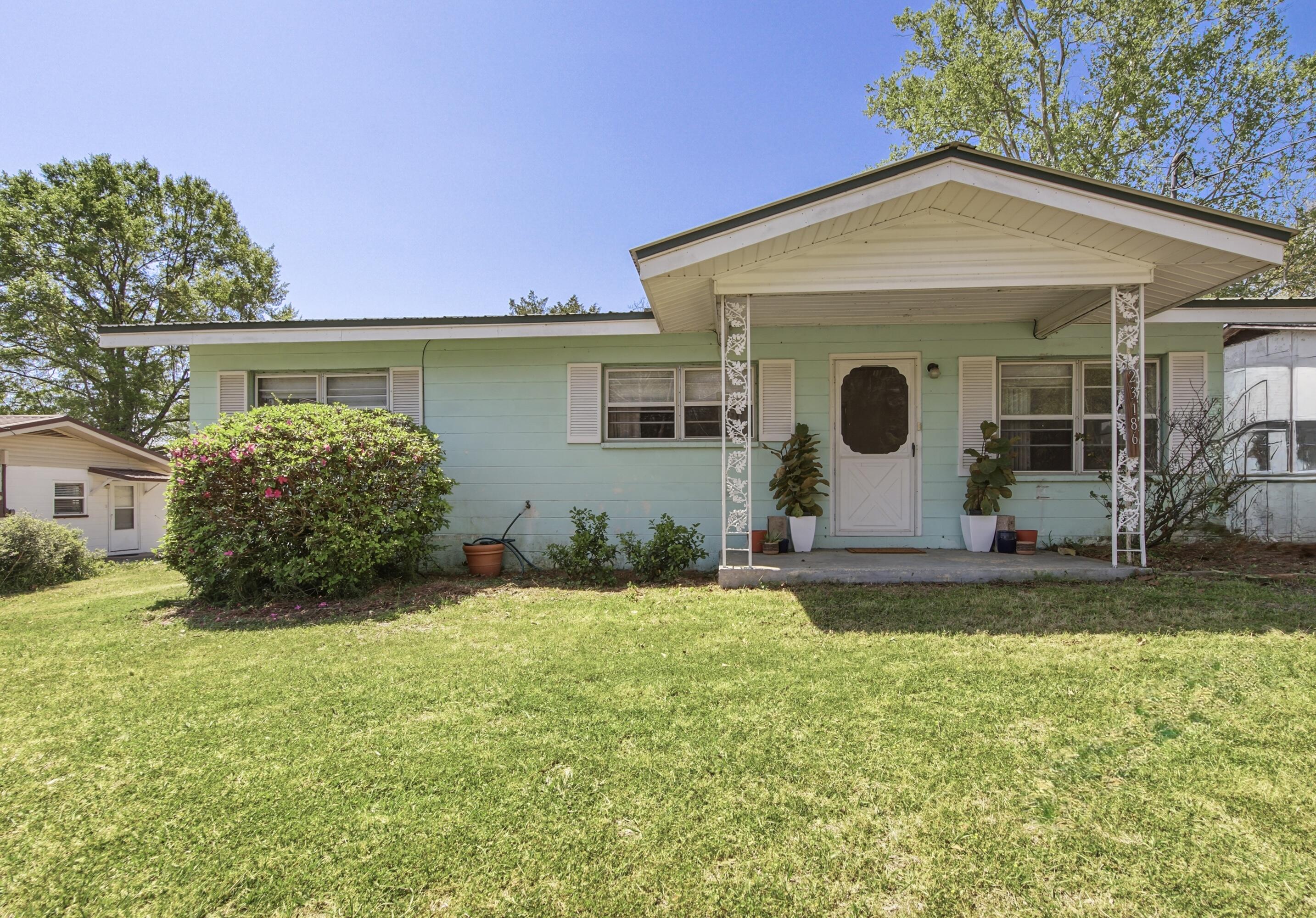 If a small, hometown vibe is on your checklist for your next home, then welcome to Florala, AL. This delightful 3-bedroom, 1-bathroom home was built tough with cinder block construction and a metal roof. The inviting front porch is perfect for quiet mornings with coffee before stepping inside to find generous sized living room leading to a spacious kitchen with plenty of cabinets and storage. The enclosed back room serves as laundry room but is large enough for hobbies and even includes an additional 8x9 storage room. The central heat and air will keep you comfortable on those cool evenings or hot summer nights. Outside you will find a 2-car carport, storage building and expansive yard await gardeners and entertainers alike. Within close proximity to downtown activities, this location is one to check out. Schedule your showing today!