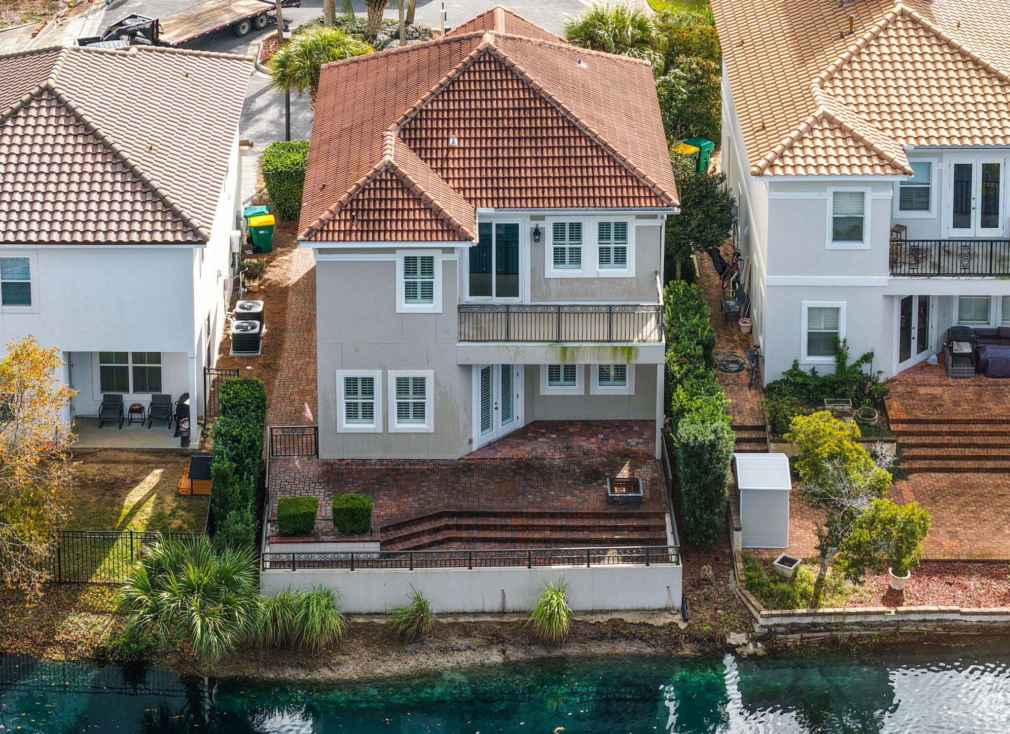 LAKEFRONT LUXURY IN THE HEART OF DESTIN! Discover a rare opportunity to own a beautifully appointed Mediterranean-style residence in the gated community of Calusa Bay--featuring a LOW HOA, premium elevation, waterfront views, and exceptional outdoor living.
Privately tucked away in a quiet rear cul-de-sac, this impressive home enjoys one of the community's more desirable elevations, offering breathtaking sunrise-to-the-east and sunset-to-the-west views across the tranquil lake. The striking exterior features a real clay tile roof and hard-coat stucco, while expansive multi-level paver terraces create an incredible setting for entertaining, relaxing and enjoying the coastal lifestyle.
Inside, soaring 10-foot ceilings, crown molding, plantation shutters, beautiful wood flooring, Spanish lace walls and ceilings, and thoughtful architectural details create an elegant yet inviting atmosphere. The kitchen features granite countertops and stainless-steel appliances, while the baths showcase cultured marble finishes. The spacious primary suite offers a private balcony overlooking the lake-the perfect place to enjoy your morning coffee or unwind at sunset.
Recent updates provide added peace of mind, including fresh interior paint (December 2025), a new water heater (2025), two approximately 5-year-old A/C units, newer dishwasher, disposal, full-size washer and dryer, and impact windows throughout.
Calusa Bay offers a gated entrance and community pool  Calusa Bay is a gated community with a community pool, all while placing you just minutes from Destin Commons, Silver Sands Premium Outlets, Sandestin, golf courses, Legendary Marina, world-class dining, entertainment, and beautiful Gulf beaches.

Waterfront homes with this combination of location, elevation, privacy and upgrades are truly rare. Don't miss your opportunity to make this Destin lakefront oasis your own--schedule your private showing today!