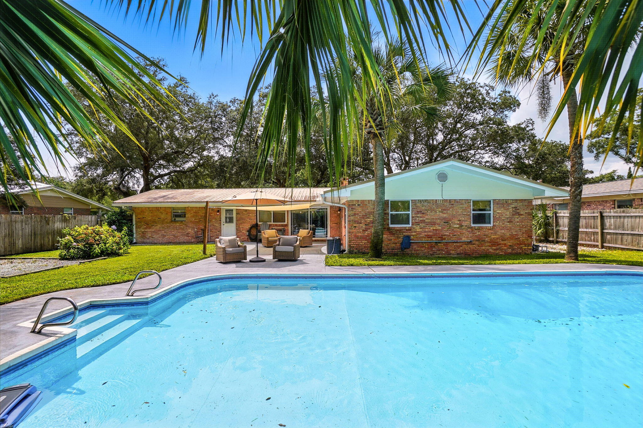 Welcome to your slice of paradise in the much desired Kenwood neighborhood! Property website: https://www.616fairwayavene.com/unbranded. This beautifully updated ranch offers a metal roof (2015), brand-new HVAC (2025), sparkling pool with new pump (2024) & liner (2021), water heater (2020), and lush St. Augustine lawn on a well-fed sprinkler system. Inside boasts fresh paint, bamboo blinds, tinted front windows, updated fixtures, anti-fog mirrors, closet organizers & a bold black fireplace. Living room opens to a private courtyard. Outside: powered shed, boat/RV parking, shaded backyard, and sidewalks throughout this subdivision. $20K in new plumbing & hurricane shutters add peace of mind—schedule your showing today!