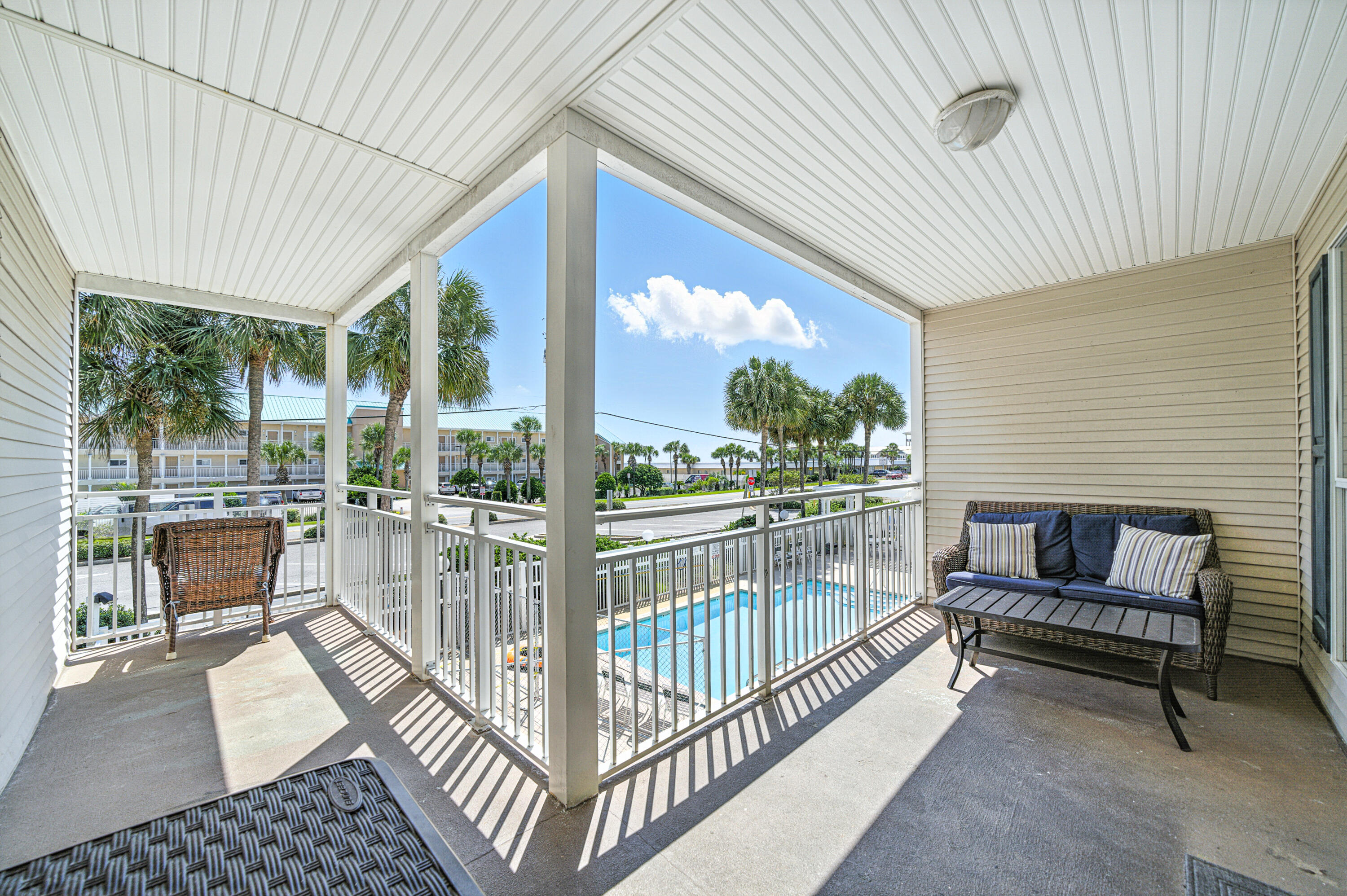 ***LOWEST PRICED CONDO IN THE BUILDING*** This perfectly located condo has 1 bed / 1 bath + hall bunks and is on the 2nd floor of this 3 story walk-up building across the street from a Public Beach Access to the Gulf of Mexico.  This unit has an exceptionally large lanai shaped like an 'L' offering great views. Full size washer/dryer in unit.  Sold completely furnished, including electronics, its ready to rent!!  HOA fees cover everything except electricity and contents insurance condo.  Contents insurance is approx. $2000 a year.  There is plenty of parking, a large pool, hot tub, a grassy area for your pets and a BBQ grill and picnic table.  The complex has passed its Milestone inspection, SIRS and has no foreseeable assessments.  Look at 'Documents' tab for governing documents.