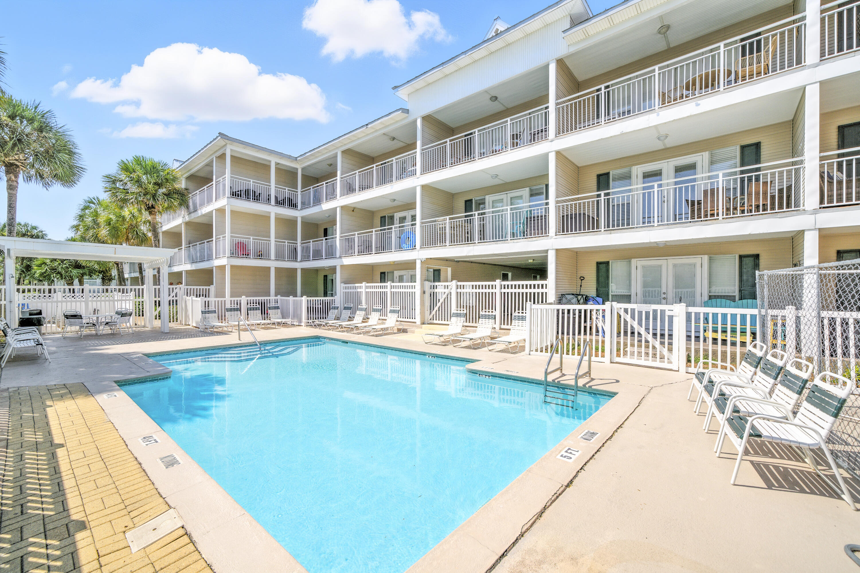 ***LOWEST PRICED CONDO IN THE BUILDING*** This perfectly located condo has 1 bed / 1 bath + hall bunks and is on the 2nd floor of this 3 story walk-up building across the street from a Public Beach Access to the Gulf of Mexico.  This unit has an exceptionally large lanai shaped like an 'L' offering great views. Full size washer/dryer in unit.  Sold completely furnished, including electronics, its ready to rent!!  HOA fees cover everything except electricity and contents insurance condo.  Contents insurance is approx. $2000 a year.  There is plenty of parking, a large pool, hot tub, a grassy area for your pets and a BBQ grill and picnic table.  The complex has passed its Milestone inspection, SIRS and has no foreseeable assessments.  Look at 'Documents' tab for governing documents.