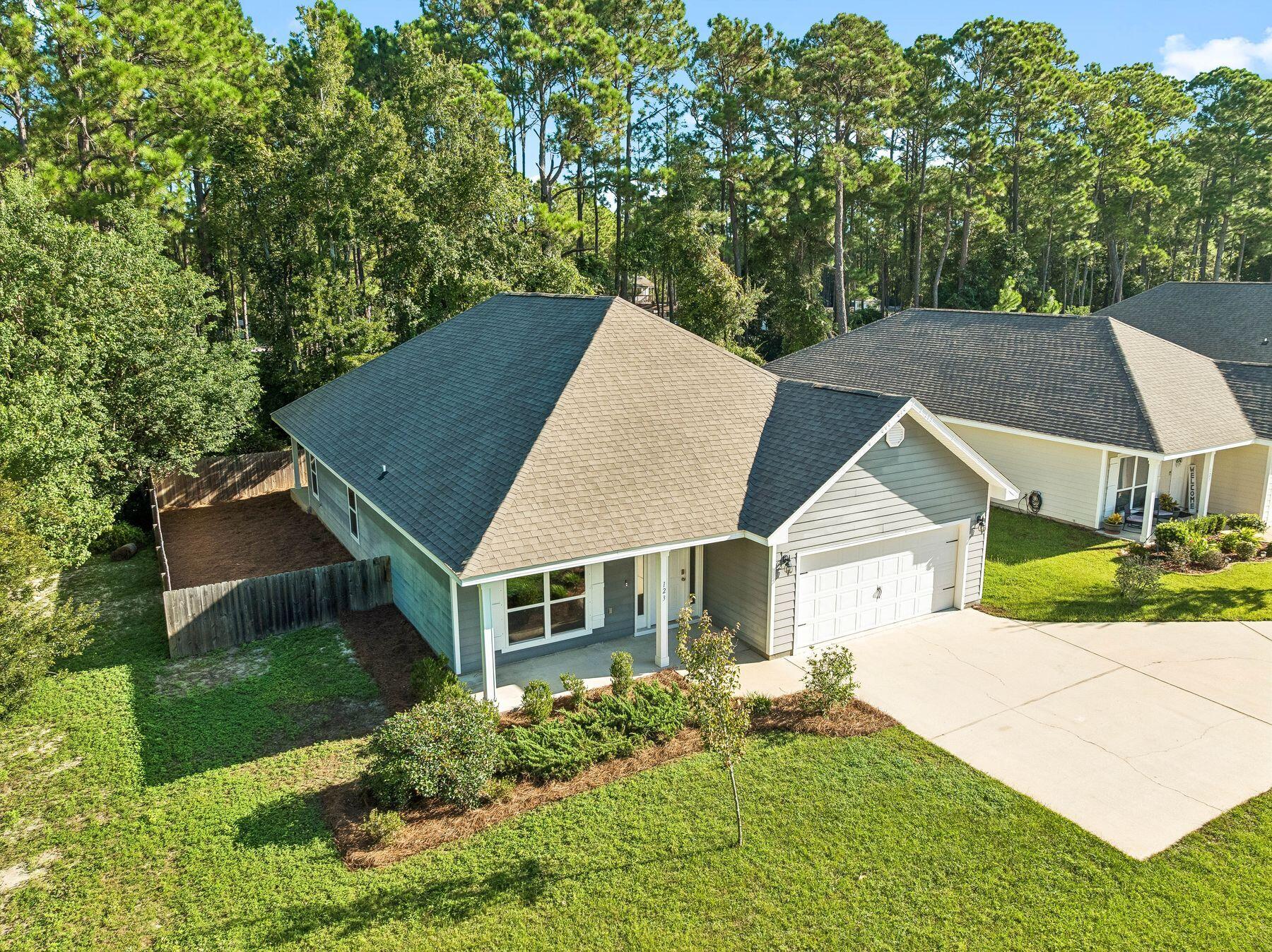 Imagine starting the morning with a walk or bike ride through the neighborhood, spending the afternoon fishing or launching the boat from nearby Charles E. Cessna Landing Park, and returning home to the privacy of one of Southern Pines' most desirable homesites. With a planned connector road and multi-use path to the South Walton Publix area underway, this North Santa Rosa Beach location offers an appealing balance of outdoor recreation, everyday convenience, and connection to the surrounding community.

The beautiful single-level home offers three bedrooms, a versatile bonus room ideal for an office or playroom, a two-car garage, and approximately 1,950 square feet of thoughtfully designed living space. Tray ceilings enhance both the primary bedroom and main living area, while the spacious primary suite includes a large walk-in closet, double vanity, walk-in shower, and separate soaking tub.

Outside, a private covered patio overlooks an expansive homesite offering a degree of privacy and usable outdoor space rarely found within the neighborhood. This is a wonderful opportunity to enjoy a functional floor plan, exceptional homesite, and an active coastal lifestyle with boating, fishing, shopping, dining, and the beaches of South Walton all within easy reach.