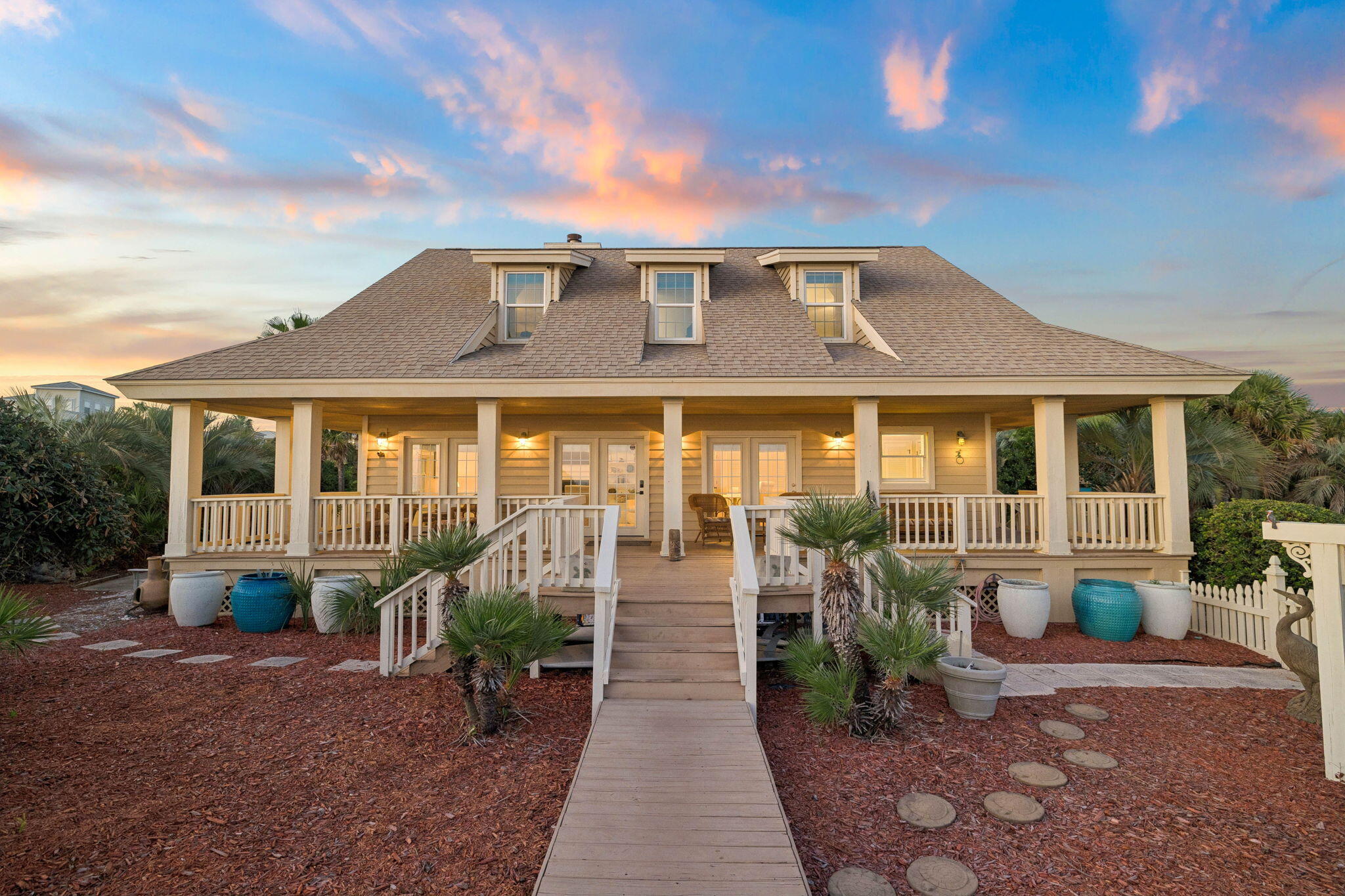 Tucked along 100 feet of pristine Gulf frontage in the heart of Seagrove Beach, this charming beach cottage perfectly captures the character and nostalgia of old Florida. With its quintessential Southern architecture, wrap-around porches, and private beach access, this four-bedroom, four-bath Gulf-front retreat offers an exceptional opportunity to own a true piece of Seagrove Beach. Designed for relaxed coastal living, the home embraces the timeless appeal of a classic beach cottage, where mornings begin with coffee on the porch and evenings unfold to the sound of the waves just beyond your doorstep. Expansive porches wrap around the home, creating inviting spaces to gather, dine, unwind, and take in sweeping views and unforgettable Gulf sunsets with plenty of room to expand. Inside, four bedrooms and four bathrooms boasting across 2,236sqft of heated/cooled living space provide comfortable accommodations for family and guests. While the home's classic character offers a wonderful foundation for those who appreciate the charm of an established coastal retreat or a canvas ready to be reimagined into your dream retreat! 
Sea Turtle Drive is a gated, non-hoa street located just minutes from the boutiques, restaurants, and iconic coastal lifestyle of nearby Seaside as well as the shopping, dining, and amenities of Greenway Station. Whether enjoyed as a private family getaway, a treasured second home, or an investment opportunity, this Gulf-front cottage offers something increasingly rare along 30A!