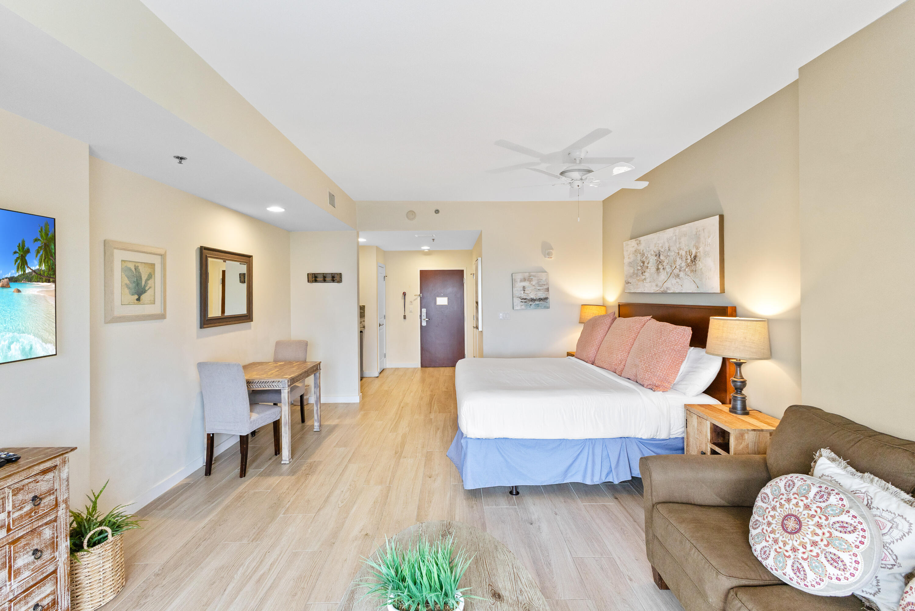 Located on the 11th floor of the sought-after Luau I building, this spacious 469 sq. ft. studio offers a serene beachside escape with a peek of the Gulf beyond. The elegant wood-look  ceramic flooring adds warmth and sophistication, creating a seamless, stylish ambiance throughout the space. Luau is a true resort oasis, boasting a heated lagoon-style pool with a tranquil waterfall, hot tub, grilling area, and a rooftop sundeck with breathtaking panoramic views stretching from the Gulf to the Bay. Stay active in the on-site fitness center or simply unwind and enjoy everything this coastal haven has to offer. Perfectly positioned on the beachside of Sandestin Golf and Beach Resort, Luau is just down from the sugar-white sand beaches, with easy access to all of Sandestin has to offer.  As an introduction to the Sandestin lifestyle, we invite our new owners to explore amenities that make Sandestin special. The listing brokerage and seller(s) are presenting the buyer(s) of this property with (2) 90-minute rounds of Tennis court time, a golf foursome at one of our three championship courses, and a round of golf for up to four (4) players at the unrivaled Burnt Pine Golf Club.
Sandestin Golf and Beach Resort features more than seven miles of beaches and pristine bay front, four championship golf courses, 15 world-class tennis courts, a 226-slip marina, a fitness center, spa and celebrity chef dining. Shop, dine and play at the charming pedestrian village, The Village of Baytowne Wharf and more. Inside the gates of the resort, residents enjoy a balanced lifestyle of high-class living, spanning the 2,400 acres from the beach to the bay. Everything within the gates of the resort is accessible by golf cart or bicycle. The entire resort is interconnected by miles of pedestrian, bike and golf cart paths that weave through groves of live oaks, meandering past natural lagoons, fountains, man-made lakes, and meticulously landscaped fairways.