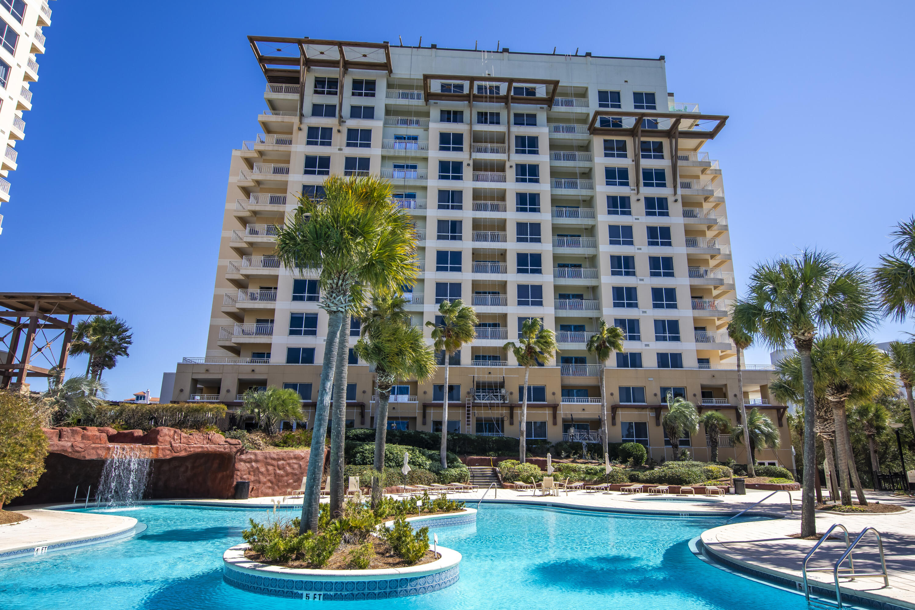 Experience unparalleled coastal living in this beautifully updated 10th-floor condo, ideally situated on the east side of Luau II within the renowned Sandestin Golf and Beach Resort. This spacious 1-bedroom unit offers 795 square feet of luxurious living space, making it the largest one-bedroom floor plan available, and boasts breathtaking, unobstructed Gulf views.

Recent enhancements include new luxury vinyl plank (LVP) flooring, and a fresh exterior repaint of the resort, ensuring a modern and pristine aesthetic. Residents can indulge in resort-style amenities such as a heated lagoon pool featuring a swim-under waterfall and grotto passageway, a heated spa, a state-of-the-art fitness center, and meticulously landscaped grounds adorned with tranquil streams, entry fountain, and barbecue areas. The complimentary resort tram offers convenient transportation to nearby attractions, including the vibrant Village of Baytowne Wharf.

As part of the Sandestin Golf and Beach Resort, owners have access to over seven miles of white sand beaches and bayfront, four championship golf courses, 15 world-class tennis courts, a 113-slip marina, and a diverse array of dining, shopping, and entertainment options. Notable nearby dining establishments include Seagar's Prime Steaks and Seafood, Bijoux, and Tommy Bahama Restaurant & Bar, all within a short distance. The property is just a brief stroll from the beach, allowing for effortless access to the pristine shoreline.