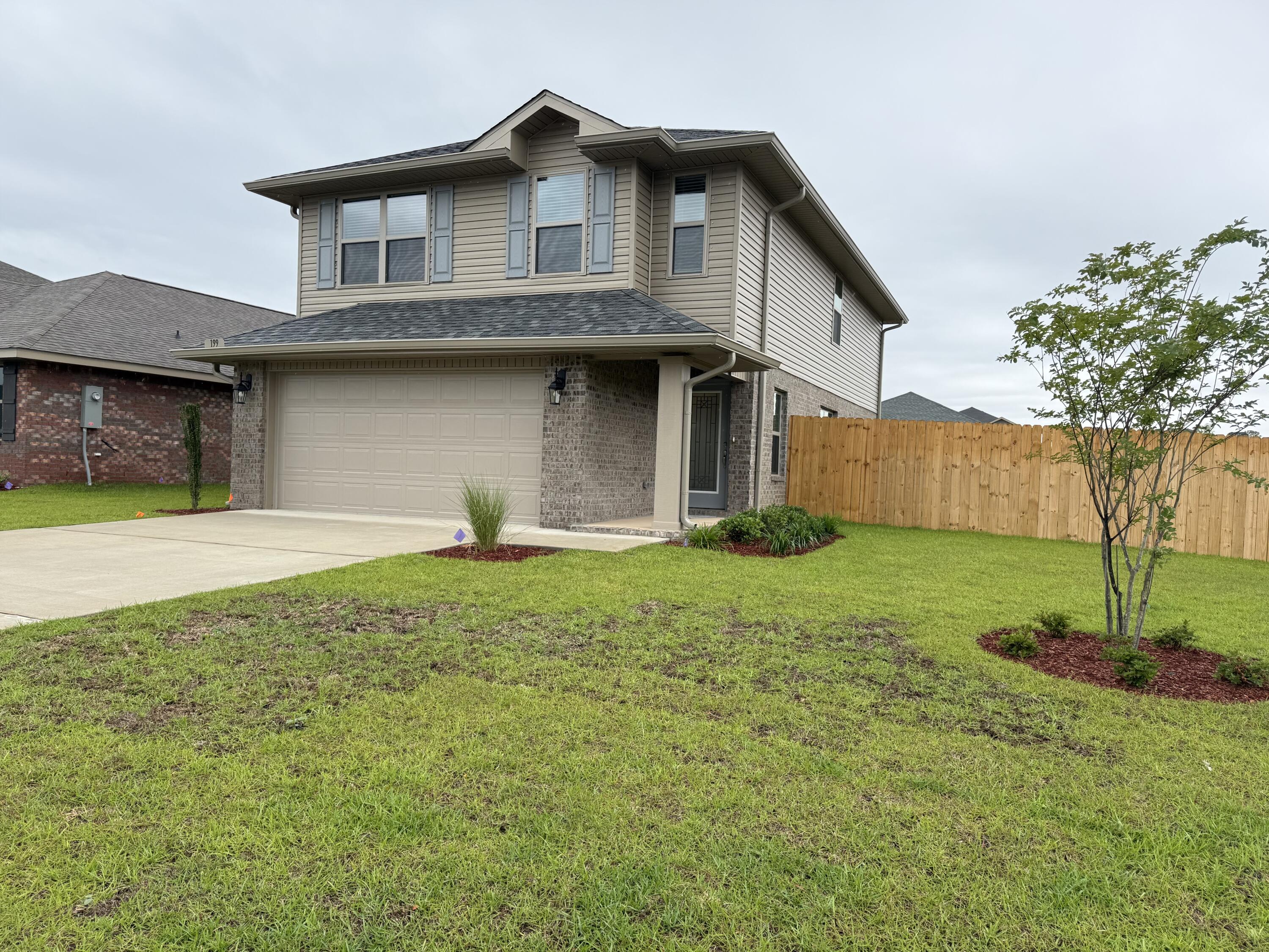 Beautiful 4-bedroom home in North Crestview! This 1,817 sq ft two-story home offers 4 bedrooms and 2.5 bathrooms, with all bedrooms conveniently located upstairs. The exterior features durable 4-sided brick and a fully finished 2-car automatic garage. Inside you'll find upgraded PureTech LVP flooring throughout the main living areas, with carpet only in the bedrooms and stairs. The kitchen and bathrooms feature  quartz countertops for a modern touch. Outside, enjoy a fully sodded yard with an irrigation system and professional landscaping. Neighborhood amenities include a community pool, sidewalks, and streetlights - perfect for family living! Fence, Blinds, Gutters, Fridge, Washer/Dryer ALL included and in the home.
