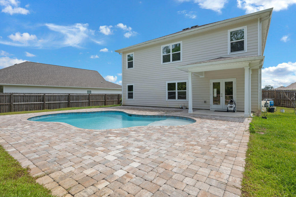 Attention Buyers! Seller is offering to match any builder incentives, including rate buy-downs or closing cost assistance, with an acceptable offer an incredible opportunity you don't want to miss! Step into luxury with this stunning 5-bedroom, 3-bath home situated on a spacious 0.24-acre lot, offering peaceful views and a beautiful saltwater in-ground pool--your own private backyard retreat. Designed for both comfort and functionality, this two-story home features multiple living areas, a dedicated office space, and an open loft upstairs, perfect for work, relaxation, or entertaining. The main level showcases stylish luxury vinyl plank flooring, while the upstairs offers warm, inviting carpet. The gourmet kitchen is a true centerpiece, complete with a large walk-in pantry, breakfast area, upgraded appliances, gas stove, and a premium refrigerator. A formal dining room--also ideal as a flex space,flows seamlessly into the spacious living area.
A convenient downstairs bedroom and full bath provide flexibility for guests or multi-generational living. Upstairs, retreat to the expansive primary suite featuring dual vanities, a soaking tub, walk-in shower, and a generous walk-in closet. You'll also find three additional bedrooms and a centrally located laundry room for added convenience. Step outside to unwind in your saltwater pool while enjoying serene natural surroundings,perfect for entertaining or simply relaxing at home. This is a must-see, schedule your showing today!