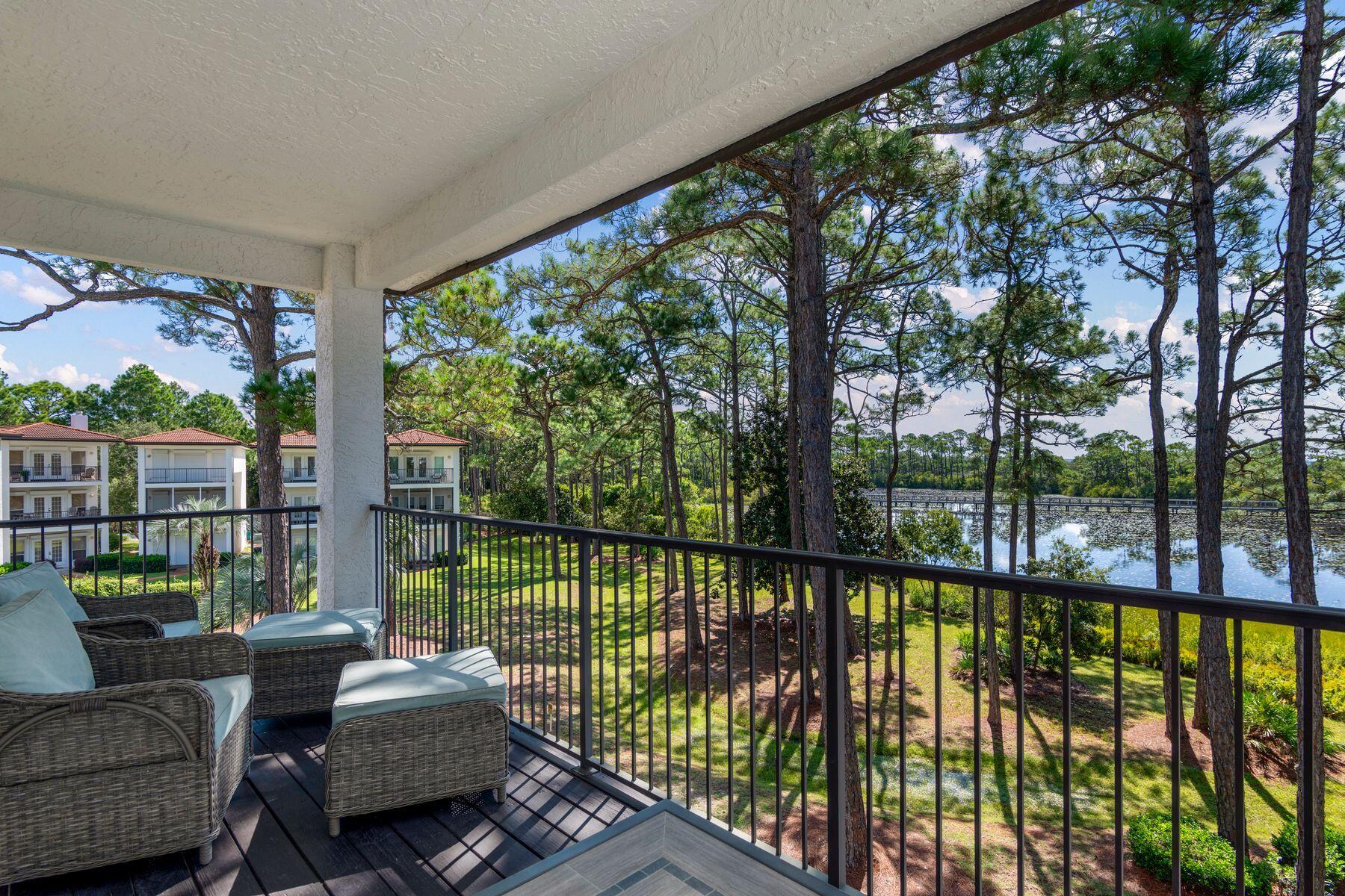 Set on a quiet, private homesite in the Seagrove community of Mar-a-Lago with three balconies overlooking Tresca Lake, this three-story coastal retreat is one of only fifteen homes in the neighborhood, offering a level of privacy rarely found so close to 30A.  The home is offered fully furnished for turnkey convenience.
On the ground level, a newly reimagined bunk suite anchors the floor, one of the centerpieces of a recent $100,000 renovation. Two full-over-full bunk beds, a wall-mounted TV, and classic arcade games Pac-Man and Ms. Pac-Man bring a spirited, nostalgic energy to the space. The adjoining bathroom has been fully renovated, with herringbone tile carried to the ceiling, a lighted niche, and designer mirrors adding a polished, boutique feel. Just beyond the back door, you'll find a patio, a private gas grill, and access to the community pool. A one-car garage rounds out the ground level.
Upstairs, the second floor unfolds as the heart of the home, with windows on two sides framing sweeping views of the lake and grounds. The living area centers around a fireplace and opens to a balcony, while a dining table for eight makes the space equally suited to quiet mornings or full house gatherings. A kitchen finished with granite countertops, stainless steel appliances, a farmhouse sink, and a bar with seating for four add another level of elegance. A laundry room and a half bath with an owner's closet complete this level. The third floor is reserved for rest, with two king suites offering distinct perspectives of the property. The primary suite commands the best view in the home, paired with thoughtful design touches including a desk alcove, a private balcony overlooking the water, including peek-a-boo Gulf views, and private bathroom. A second king suite offers its own balcony, tall windows, and a private bathroom.
The Mar-a-Lago community offers 400 feet of frontage on Tresca Lake, along with an impeccably-maintained pool and manicured common grounds. Natural gas service has been extended to the street and is available for connection to the home. Enjoy easy beach access at nearby Walton Dunes, where 400 feet of county-owned sand stretches wide, deep, and flat along the Gulf.
