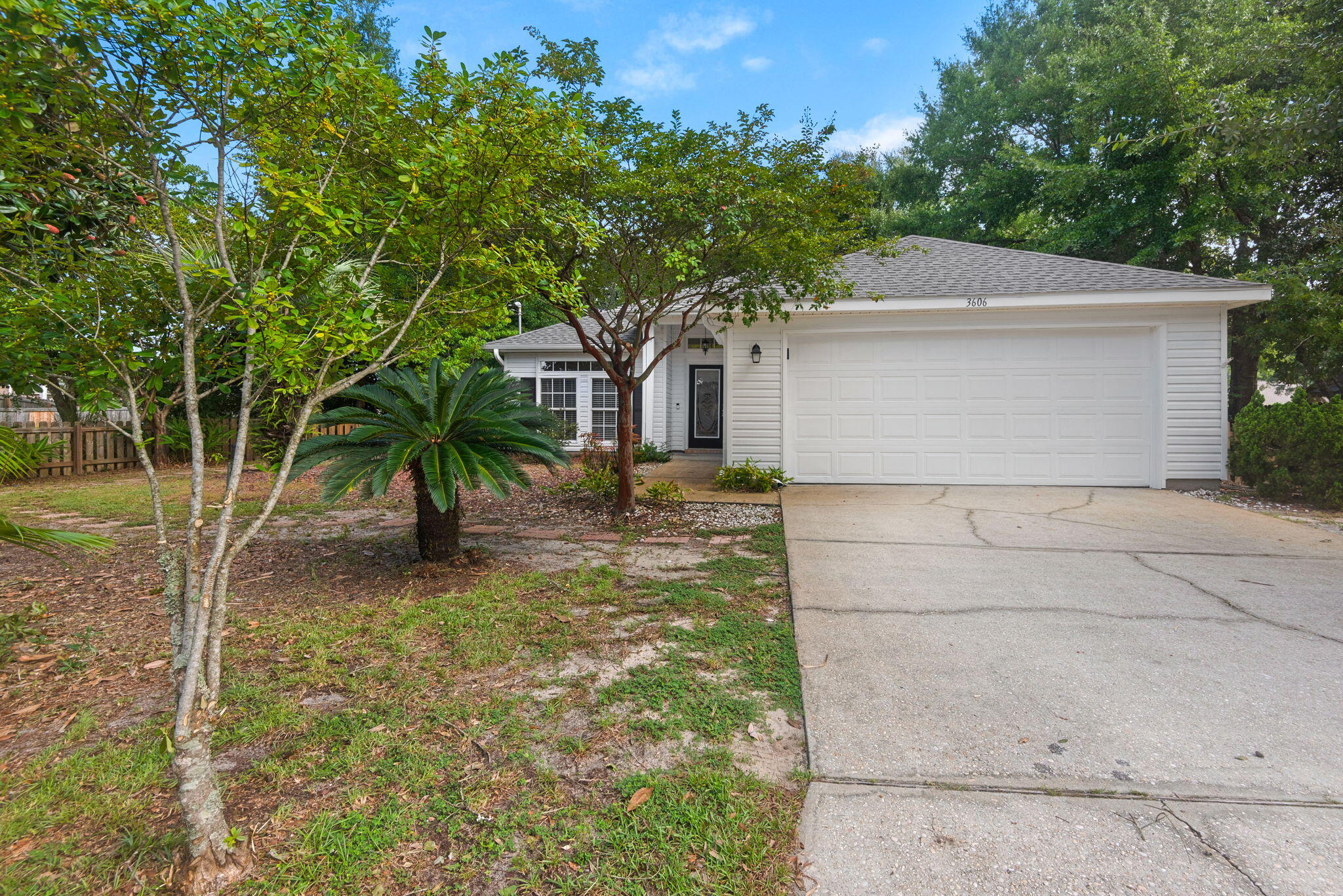 Welcome to Gulf Breeze living at its best in this beautifully maintained one owner home!  A 3-bedroom, 2-bathroom home featuring a 2-car garage, spacious corner lot, and NO HOA. Built in 2004, this residence offers a thoughtfully maintained interior with luxury vinyl flooring throughout, providing a clean, contemporary look with the ease of low-maintenance living and no carpet.  Freshly painted and ready for you! The primary bedroom is super spacious with a large walk in closet. The primary bathroom has dual vanities and a walk in shower with a transom window for natural light.  Two additional bedrooms with big closets share a bathroom with tub/shower combo in between. The great room is open to the kitchen with a hop up bar.  Washer, dryer and refrigerator are included for your convenience.  The outdoor spaces are equally inviting, with lush landscaping enhancing the property's curb appeal and creating a private, welcoming setting.  A generous screened in patio and additional 13X10 concrete patio provides an ideal extension of the living space for outdoor dining, entertaining, morning coffee, or relaxing and enjoying the Gulf Coast lifestyle. The oversized garage has a utility sink and an A/C unit.  A storage shed offers additional space for tools, bikes, beach equipment, and recreational essentials.  Recent and valuable improvements include a newer roof and whole house generator, offering added peace of mind and convenience for Florida l living. The sprinkler system is on a well- no city water.  Ideally positioned in Gulf Breeze, this home is conveniently located near Redfish Point fishing, area beaches, shopping, dining, and everyday amenities, including Walmart and Publix. Easy access to the Garcon Point Bridge provides convenient connectivity throughout the surrounding area. Don't miss this gem- make your appointment today!