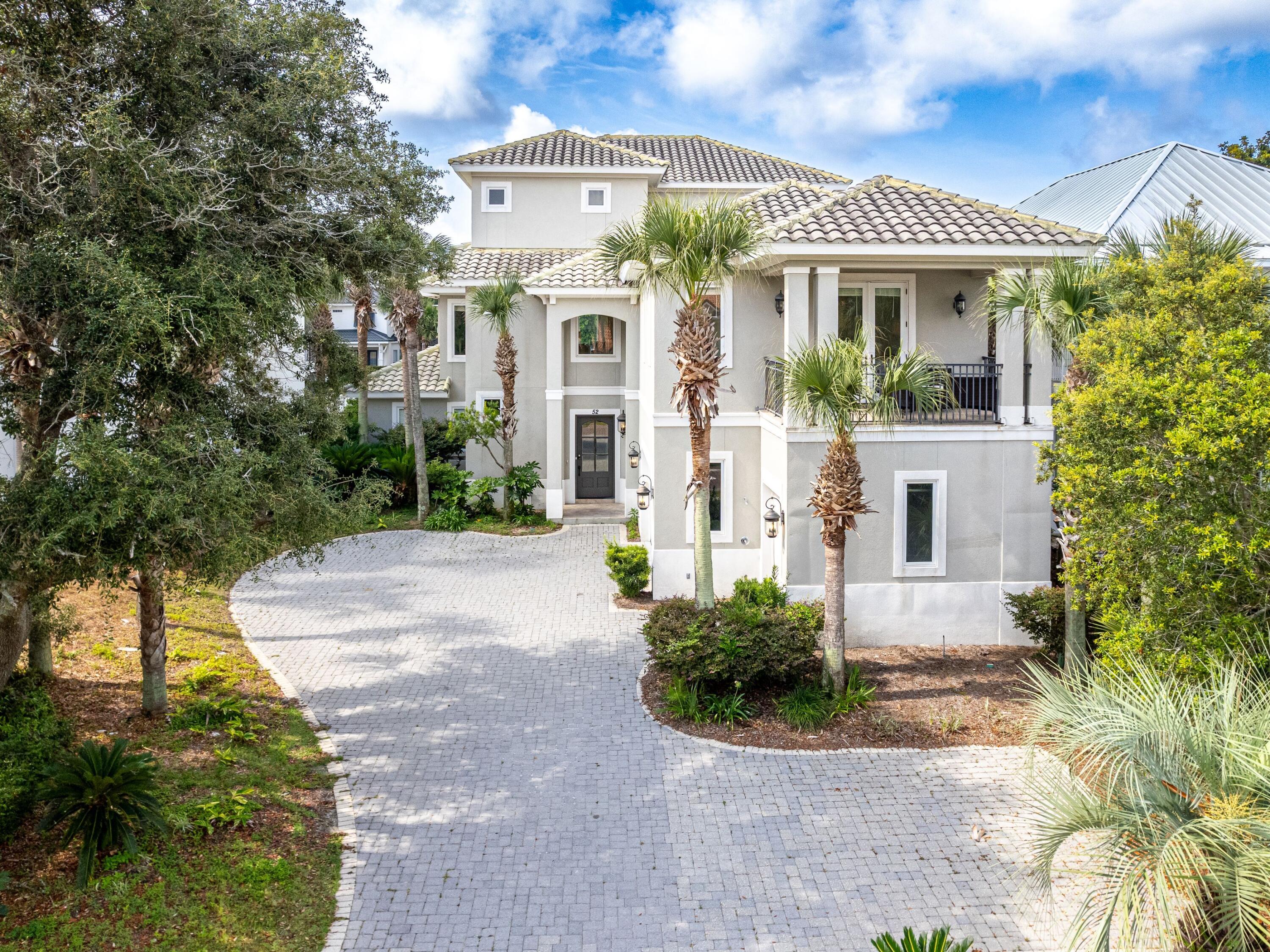 Positioned along Scenic Highway 98 within the gated community of Destiny East, this impressive three-story residence offers an exceptional combination of scale, comfort, and gulf view corridors just moments from the shoreline. Spanning 4,339 square feet with five spacious bedrooms, the home presents a rare opportunity for those seeking a fully furnished coastal retreat with strong rental potential in one of the area's most desirable locations.

Thoughtfully updated and professionally decorated, the residence has undergone more than $200,000 in recent improvements, creating a refined yet relaxed atmosphere throughout. The open floor plan invites effortless entertaining, with large windows that draw in abundant natural light and highlight the home's generous living spaces. At the center of the main living area, the chef's kitchen features stainless steel appliances, granite countertops, and custom cabinetry designed to support both everyday living and large gatherings.

Outdoor living takes center stage with oversized wraparound balconies that capture beautiful southwest views toward the gulf. These expansive spaces provide the perfect setting for morning coffee, sunset cocktails, or relaxed evenings enjoying the coastal breeze.

A private elevator services all three levels, adding convenience and accessibility throughout the home. The top floor is dedicated entirely to the primary suite, creating a private retreat that includes a spacious sitting area with western views, a custom bar, and a luxurious ensuite bath with dual vanities. The thoughtful layout provides privacy and comfort for both owners and guests.

Additional highlights include a two-car garage with a dedicated golf cart parking stall, along with the inclusion of furnishings, televisions, and a golf cart, making the home turnkey for immediate enjoyment or rental use.

Recent upgrades further enhance the property's value and efficiency. The second-story balcony was completely rebuilt in 2024, attic insulation was added the same year, and new air handlers serve all three levels. Tankless hot water heaters have been installed throughout the home, while new blinds provide a clean, updated finish across the interior.

The expansive homesite also offers the potential to add a small private pool at the front of the property, creating an additional outdoor amenity to complement the nearby beach access and lakefront community pool.

Residents of Destiny East enjoy access to a wide range of amenities designed for both relaxation and recreation. These include multiple community pools, a spacious clubhouse, tennis courts, fitness center, spa-style pool area, playground, grilling and picnic areas, pavilion spaces, and even a private IMAX movie theater.

With its generous scale, recent improvements, turnkey furnishings, and close proximity to the beach, this coastal residence represents an outstanding opportunity to own a gulf-view home along one of the Emerald Coast's most sought-after corridors.